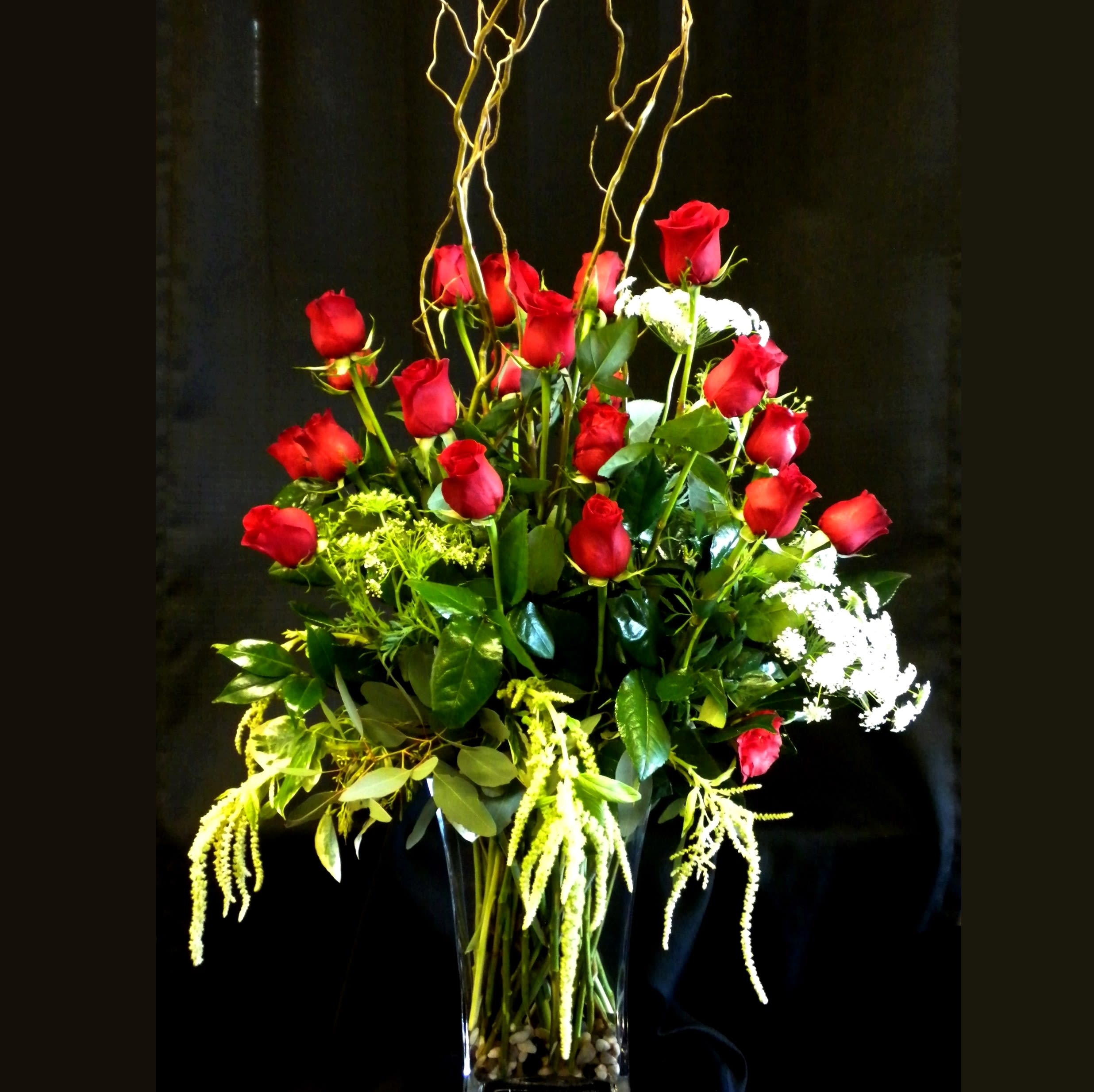 Take My Breath Away - &quot;Take My Breath Away&quot; is a dramatic display of two dozen premium red roses, accented with hanging Amaranthus, lush greenery and curly willow in a tall vase. A breathtaking statement of love and elegance, available in Danville, CA.  