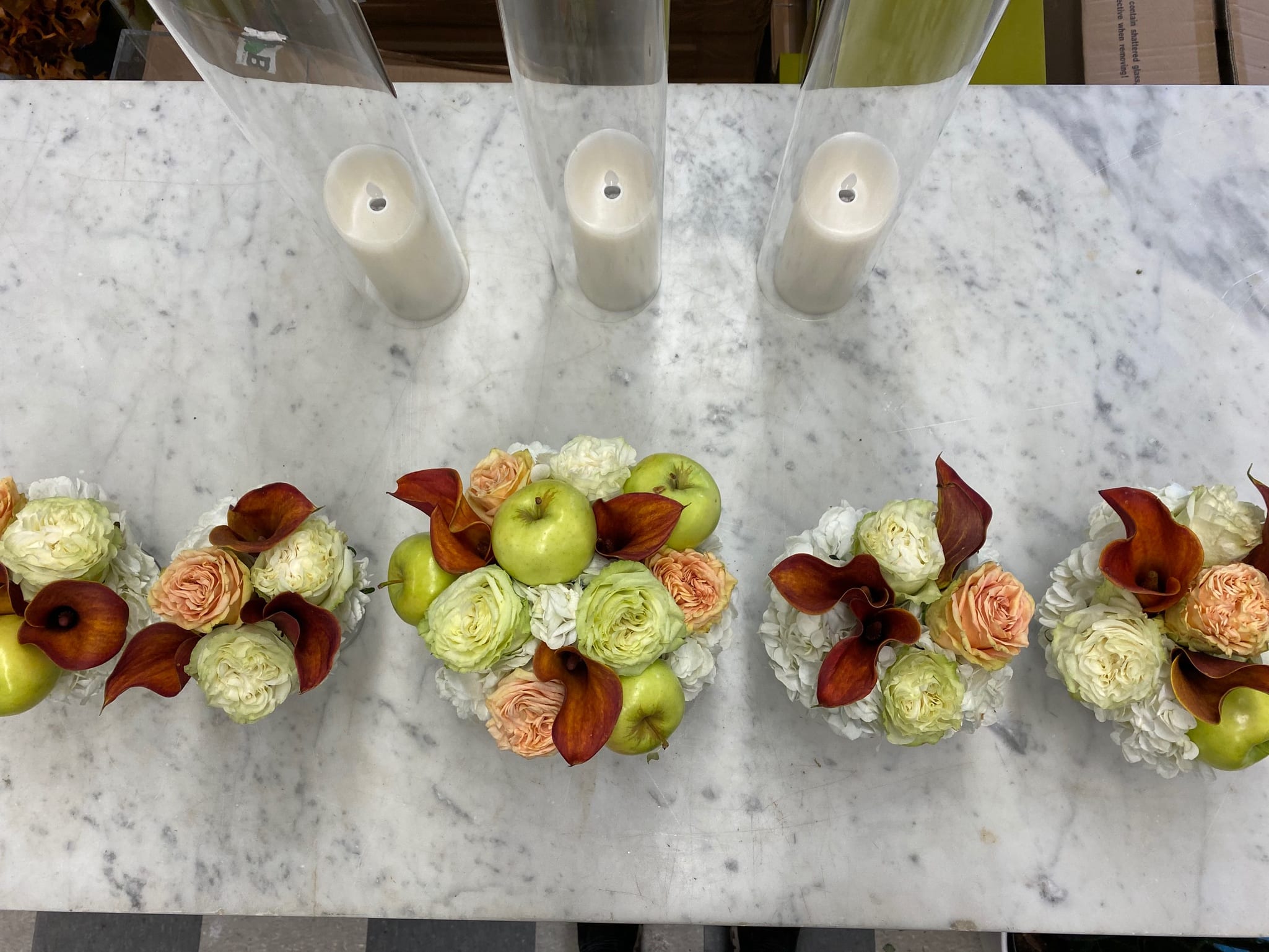 THANKSGIVING TRIO CENTERPIECE WITH FRUIT - Small vases of autumnal bloom fit perfectly on your food-filled Thanksgiving table