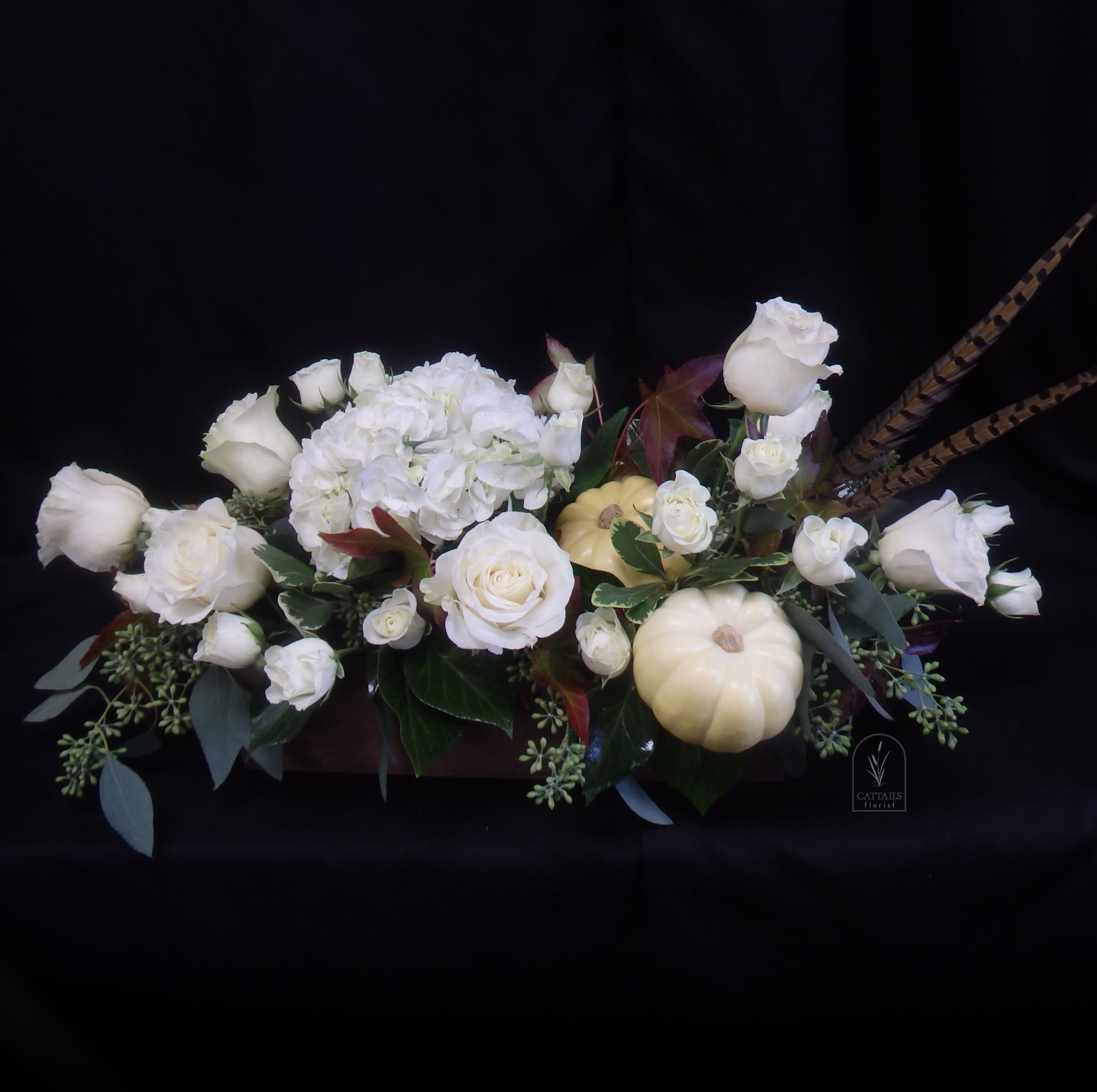 Toasted Almond - &quot;Toasted Almond&quot; is an elegant fall arrangement in Danville, CA, in a large wooden box showcasing creamy white roses, spray roses and hydrangeas paired with soft ivory pumpkins, seasonal foliage, and pheasant feathers for a refined autumn centerpiece. 