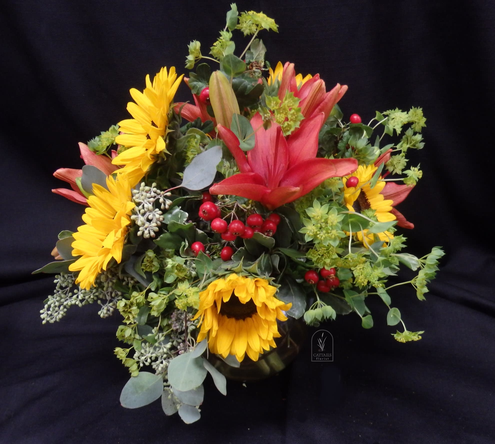 Sun and Salsa - Compact style bowl with bright Sunflowers, Lilies and berries  