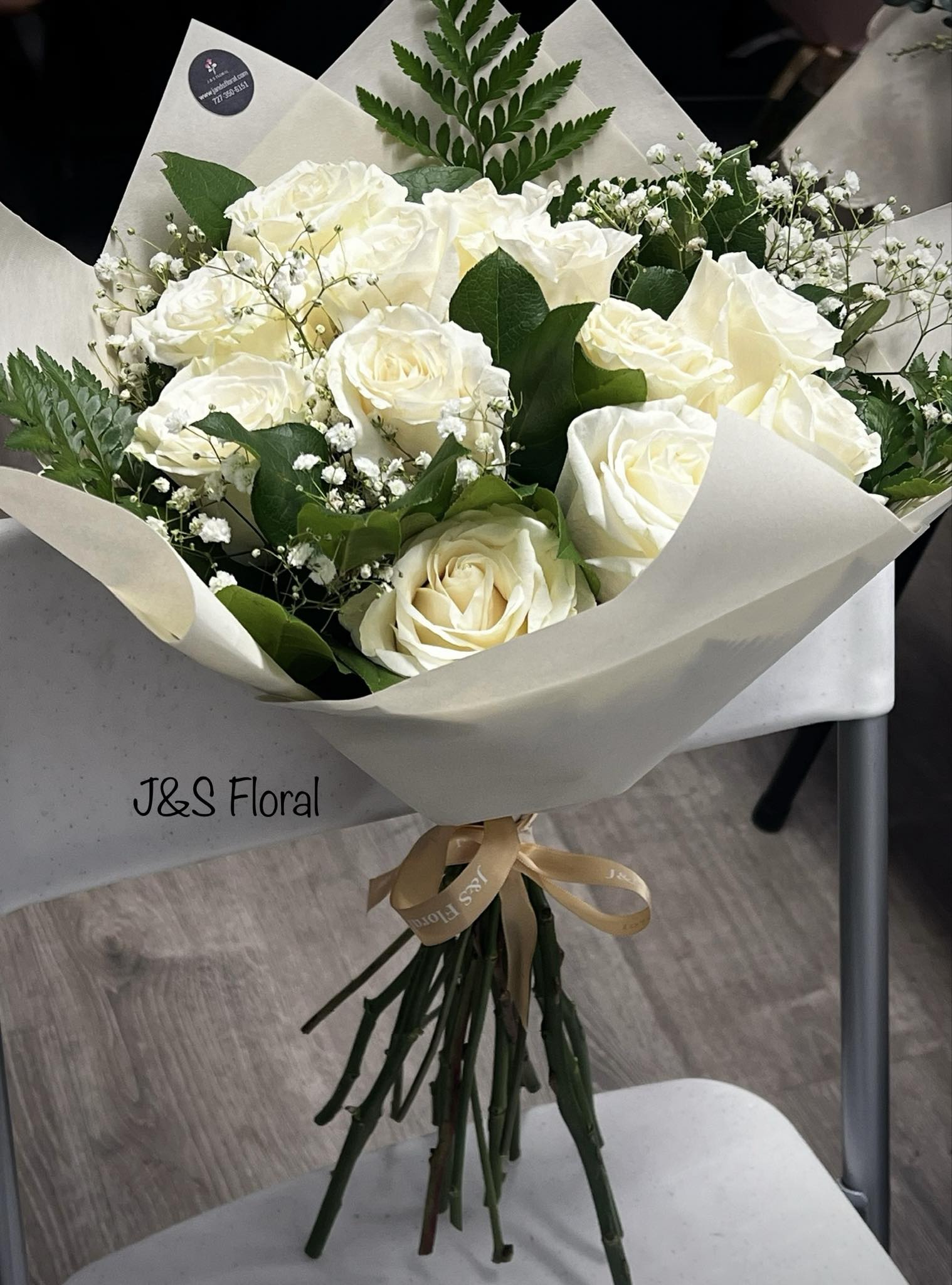 White Roses Bouquet  - Introducing our white roses bouquet, beautifully made with white roses, baby's breath, and greenery and wrapped with ribbons