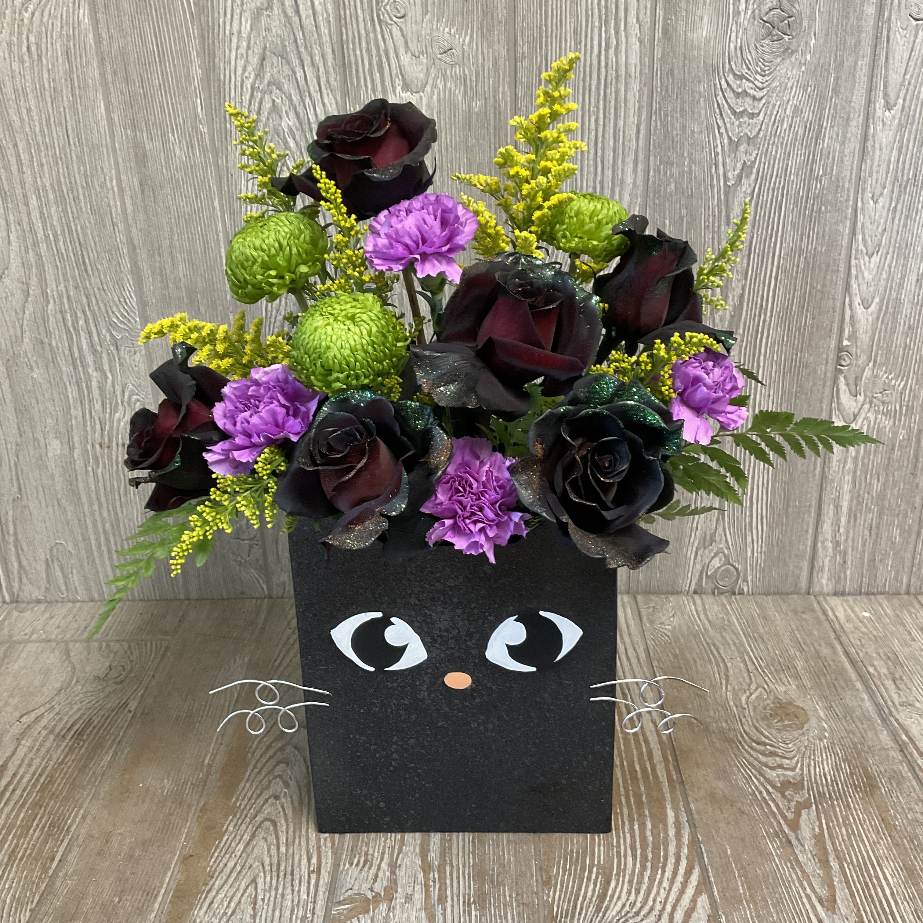 Whiskers The Cat - This scaredy-cat came out of hiding to give you a boo-quet of Halloween roses and other freaky flowers in a keepsake tin! 
