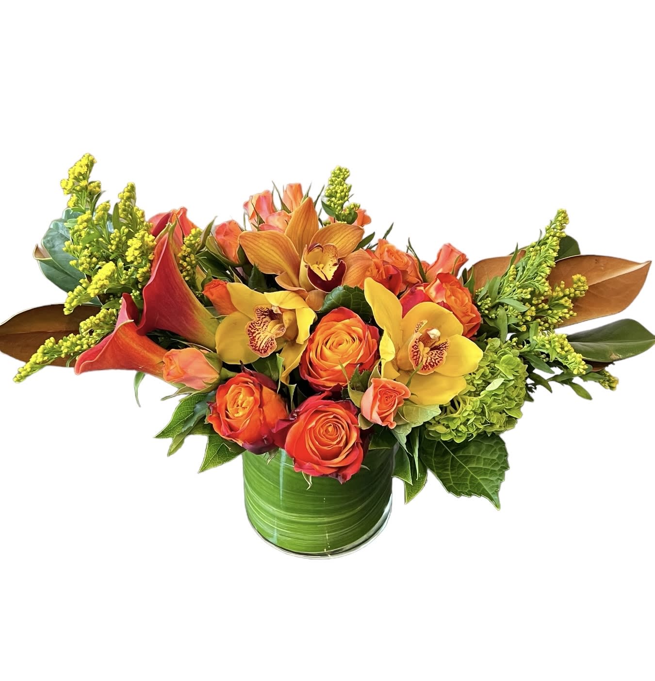 Harvest of Blessings - Orange roses, orange spray roses, calla lily, yellow orchid, green hydrangea, yellow aster and greens designed in a cylinder leaf wrapped vase.