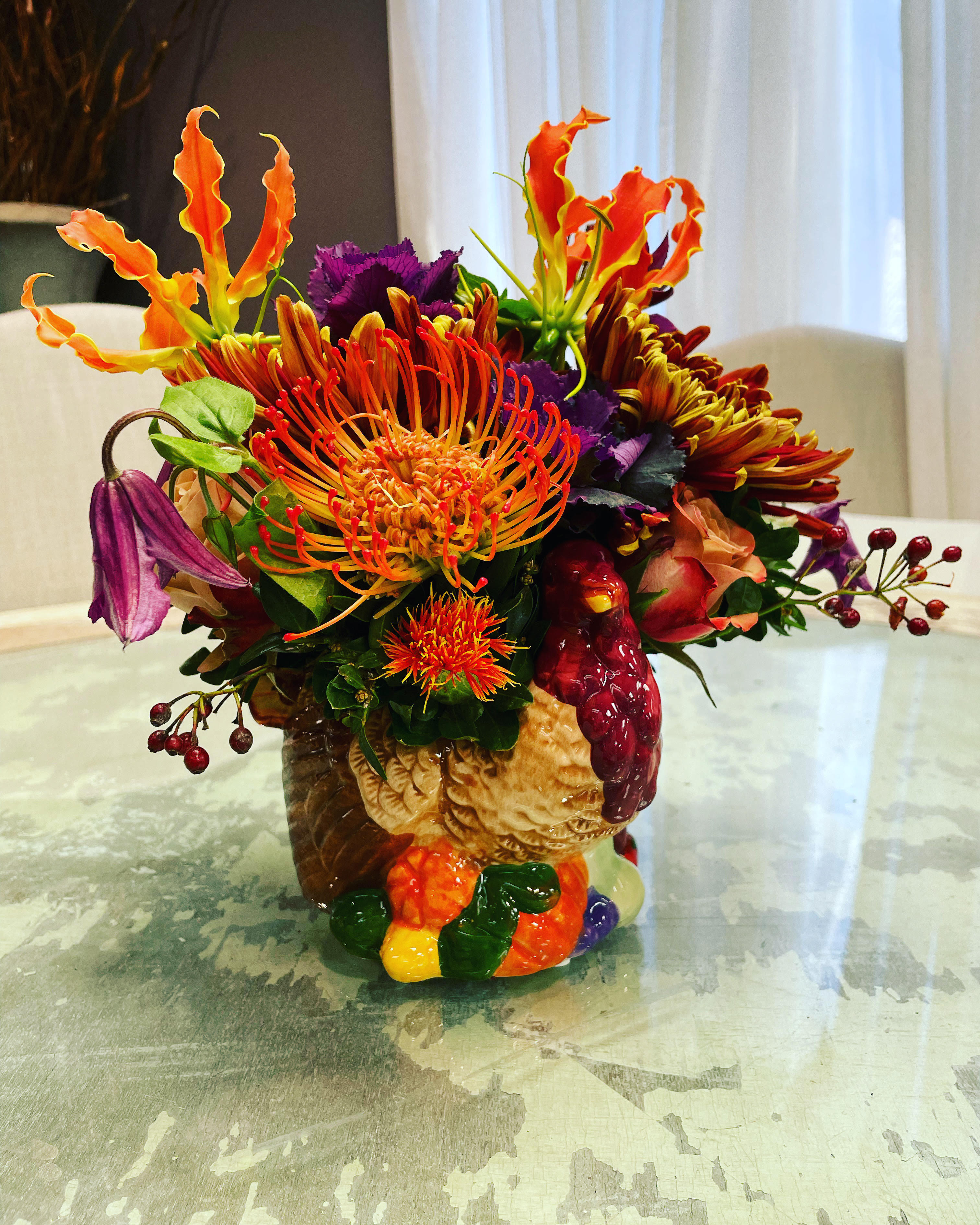 The Thanksgiving Turkey  - A bright and cheery arrangement in a ceramic Turkey container. 