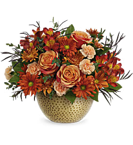 Vintage Gold Centerpiece - Our Vintage Gold Centerpiece adds autumnal elegance to your fall celebrations. This fall floral arrangement is filled with radiant orange roses and artfully arranged in a magnificent metal bowl with hammered gold finish. 	Approx. 16 1/2 W x 13 H