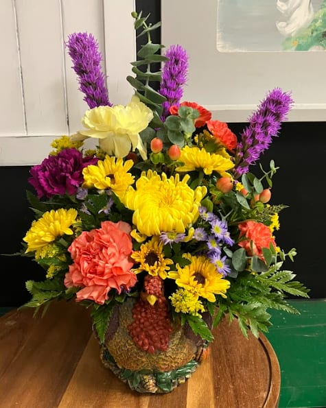 Give Thanks Turkey  - Bring a whimsical touch to the Thanksgiving table.  Our fun and unique planter is filled with fresh, festive seasonal accents for cozy ambiance.