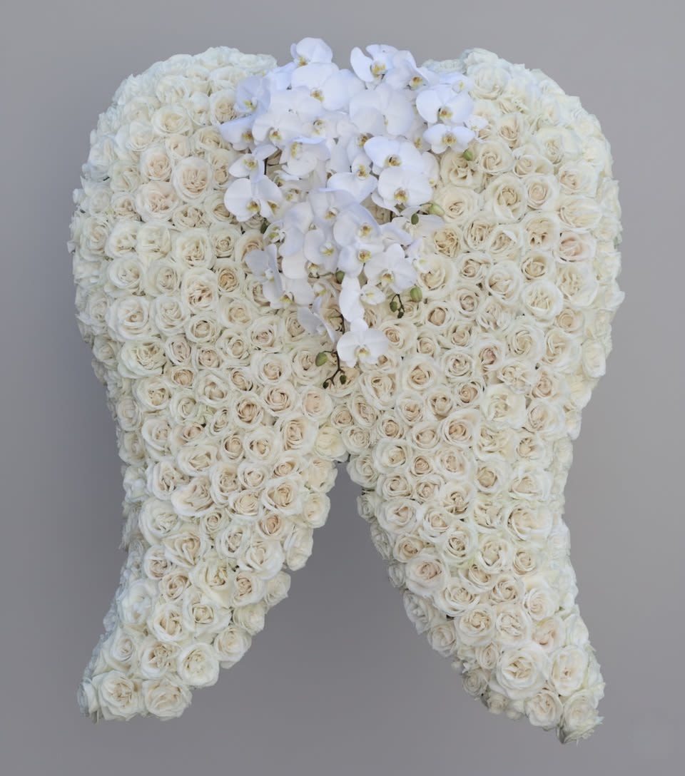 Angel Wing  - These angel wings in the standard size stand at 3ft x 4ft, and increases by 30% more when you upgrade to deluxe or premium. The middle stencil can be substituted by a spray, and we can accommodate an color palette. Please place order at least one week in advance of the service. 