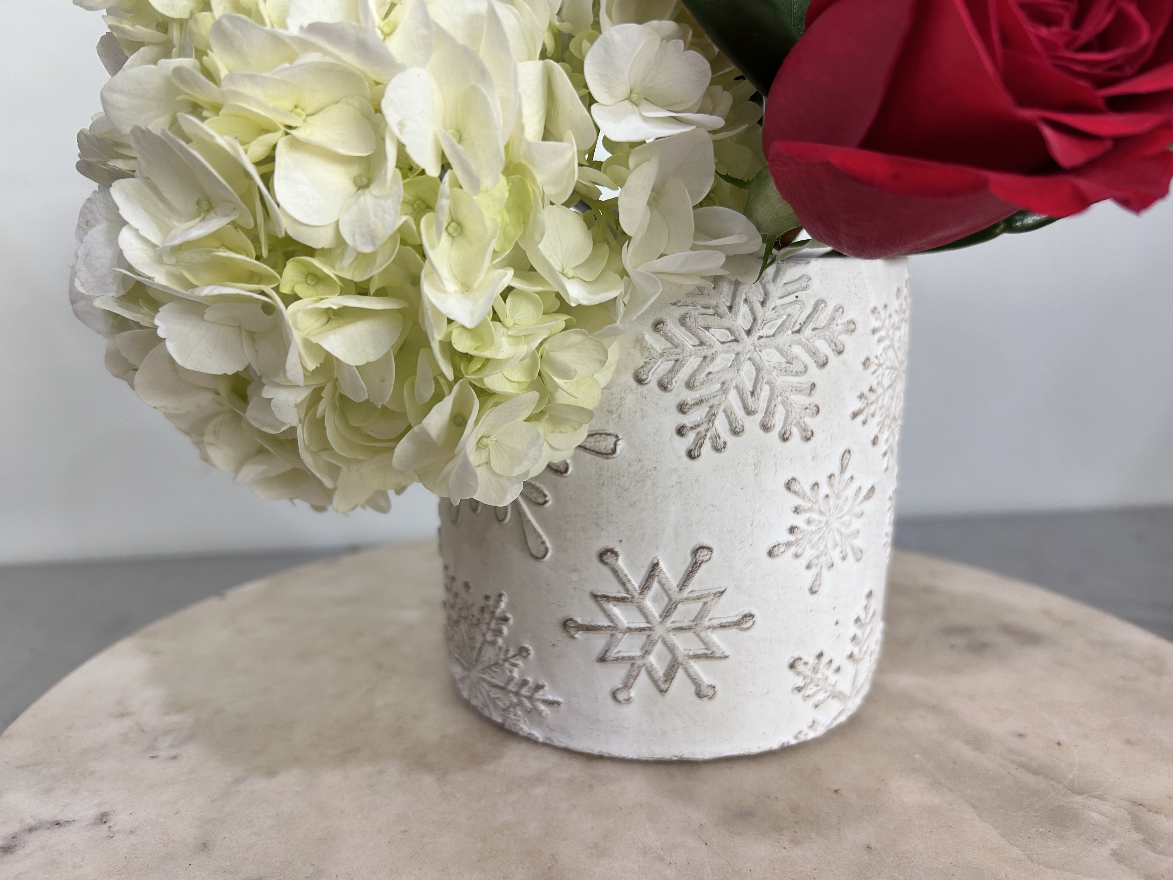 Snowflake Vase - Seasonal flowers for a pretty vase with snowflakes. Arrangement size similar to medium pinecone arrangement. 