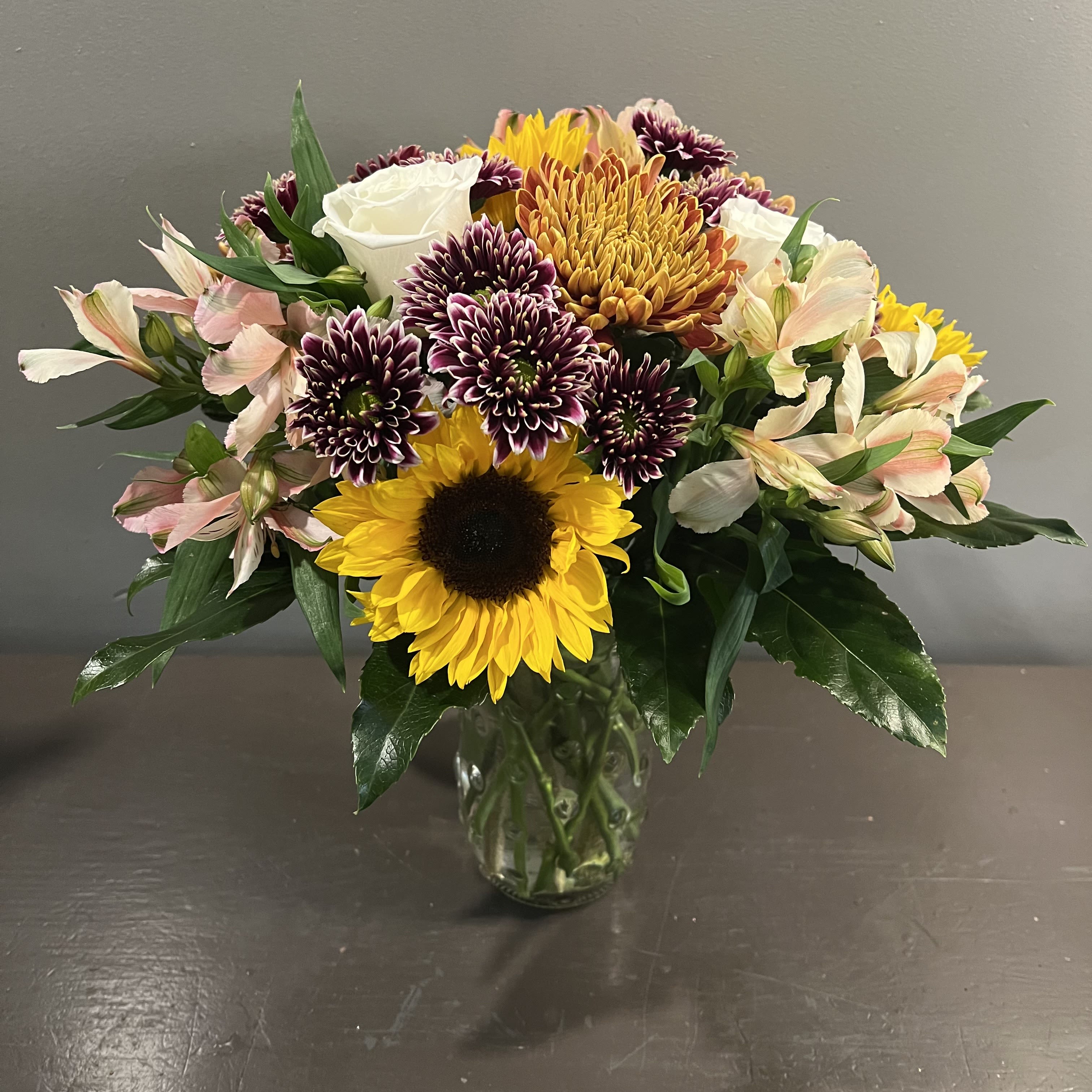 Autumn Whimsy - A whimsical bouquet in shades of autumn.  Measures approx. 16&quot;Tx15&quot;W and arrives in a glass vase.