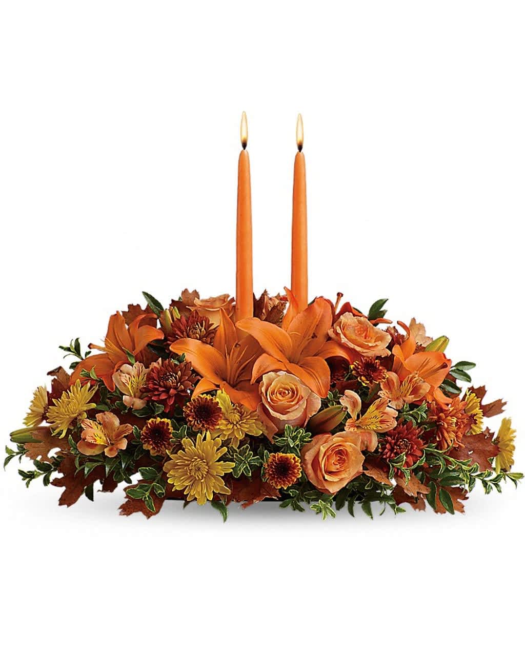 Family Gathering - Introducing our Family Gathering Centerpiece, an exquisite arrangement filled with the warmth and beauty of autumn. This centerpiece combines the vibrant hues of orange lilies, peach roses, golden and brown mums, and orange alstroemeria, along with an array of greens and filler. It is the perfect centerpiece to create a welcoming and inviting atmosphere for a family gathering.   