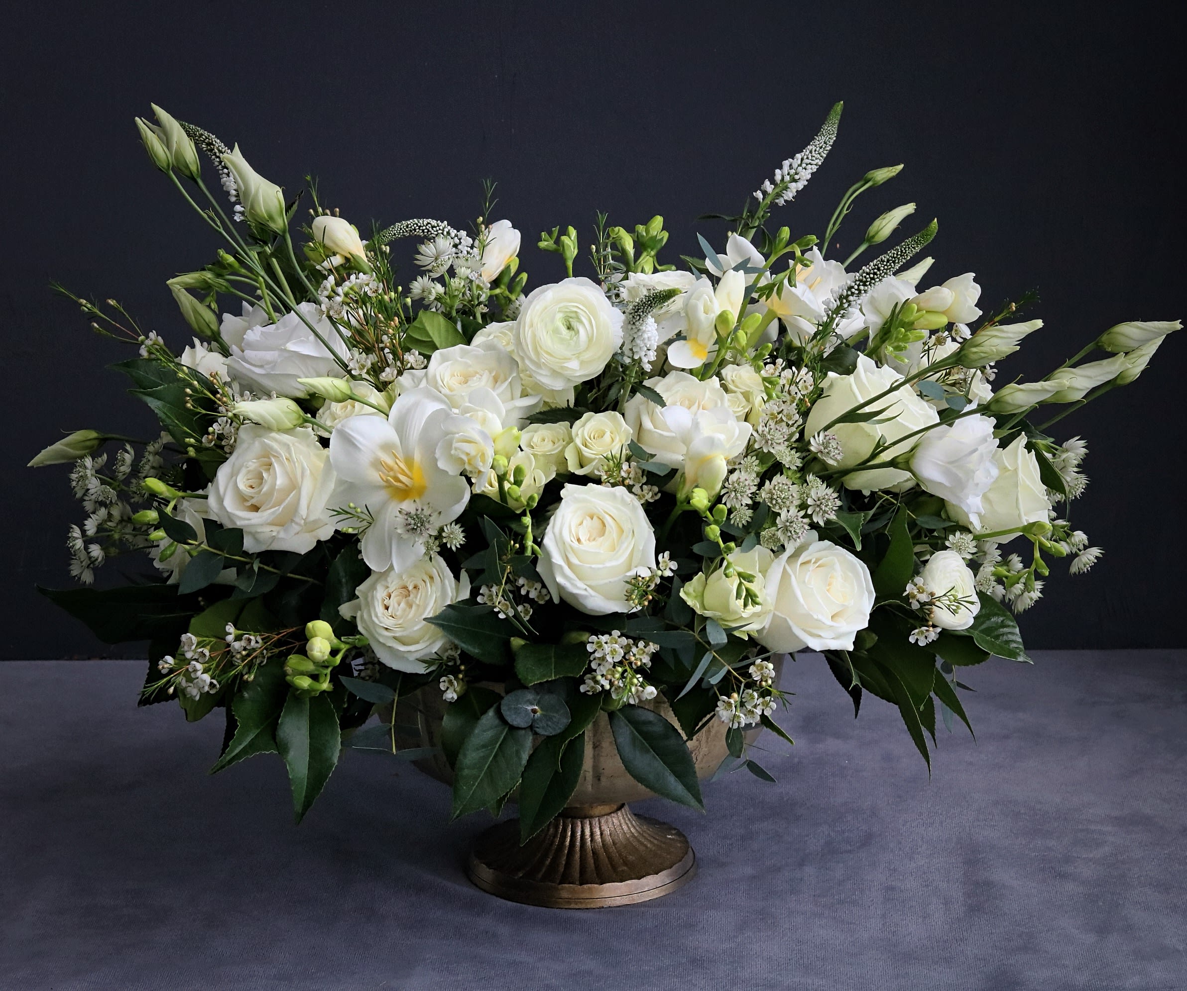 white elegance - This elegant arrangement contains premium mixed florals, beautifully laid out in a compote vase. Handwritten card is included. Send the most beautiful flowers for that special someone. Next day delivery available to Tequesta, Jupiter, Palm Beach Gardens and Palm Beach.