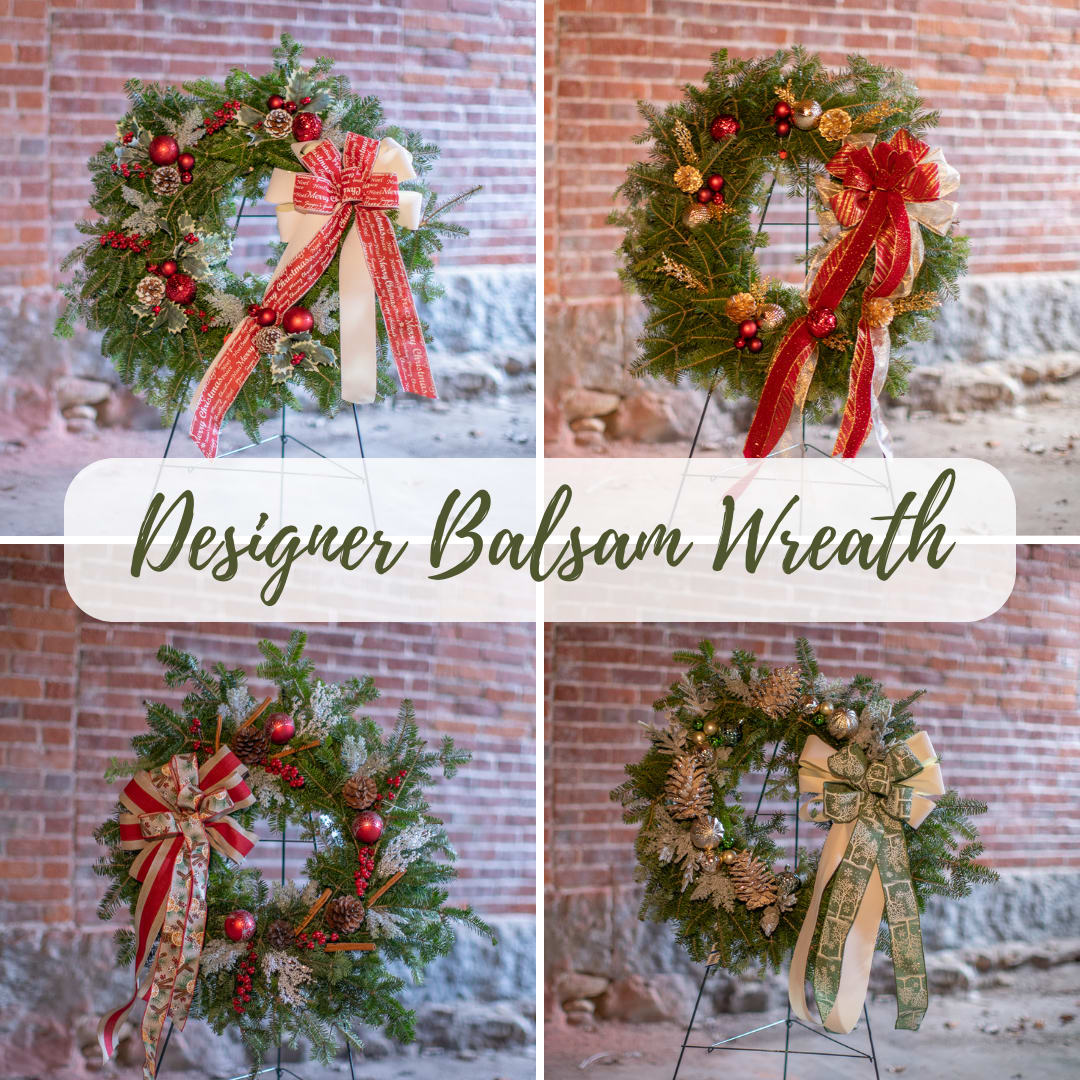 Designer Winter Wreath - Fragrant fresh balsam wreath decorated with cones, ornaments, winter trimmings, bows, berries and holiday accessories. Color combinations can be included in special instructions. Wreath bases are traditional door sized rings approximately an 18 inch outer diameter. Upgrades will include additional decorations and incorporation of additional seasonal greens, like boxwood, cedar and Carolina sapphire.