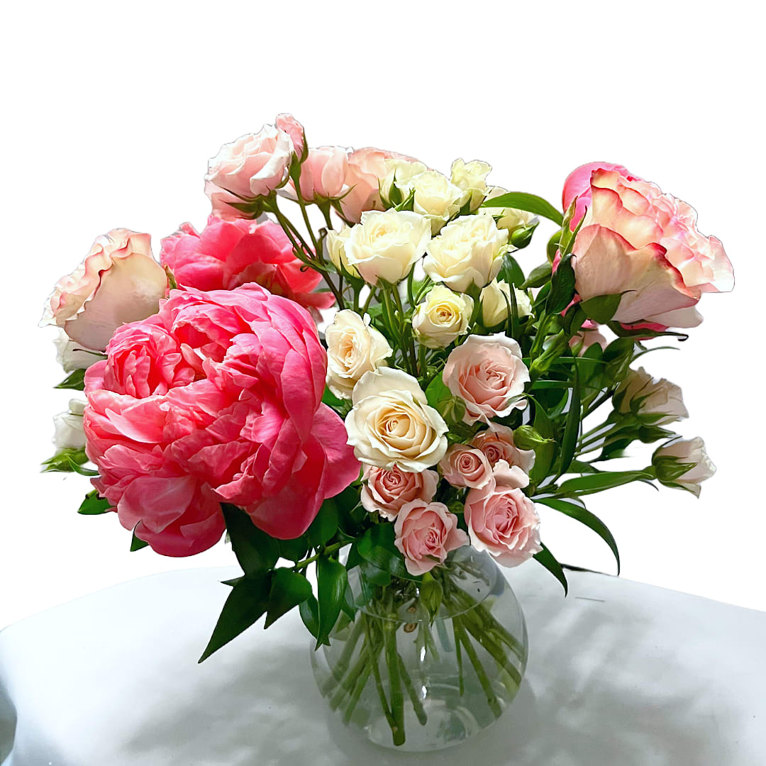 Peony Season! - Experience the Splendor of Peony Season Peonies are the darling of the floral world, and we've secured the best for our local customers! Larger in size than the packs you may find in the local grocer, these peonies are a pure delight to watch unfold in your home day after day. Available now, enjoy pinks, coral, and whites during May, which brings a fresh vibrancy to your space.  **Exquisite Peonies: Known for their large, showy blooms and delightful fragrances, peonies are a favorite for their beauty and elegance. **Paired with Roses: This arrangement features peonies paired with roses and spray roses, creating a full look with a delightful, mild fragrance. **Seasonal Availability: Peonies are typically in season during spring, and often bloom in April and May. However, our selection is available through winter, offering an extended opportunity to enjoy these stunning flowers. &quot;Peony Season&quot; is perfect for adding a touch of luxury to your home or as a thoughtful gift for someone special. Revel in the beauty and fragrance of peonies with this exquisite arrangement from Elizabeth's Garden.