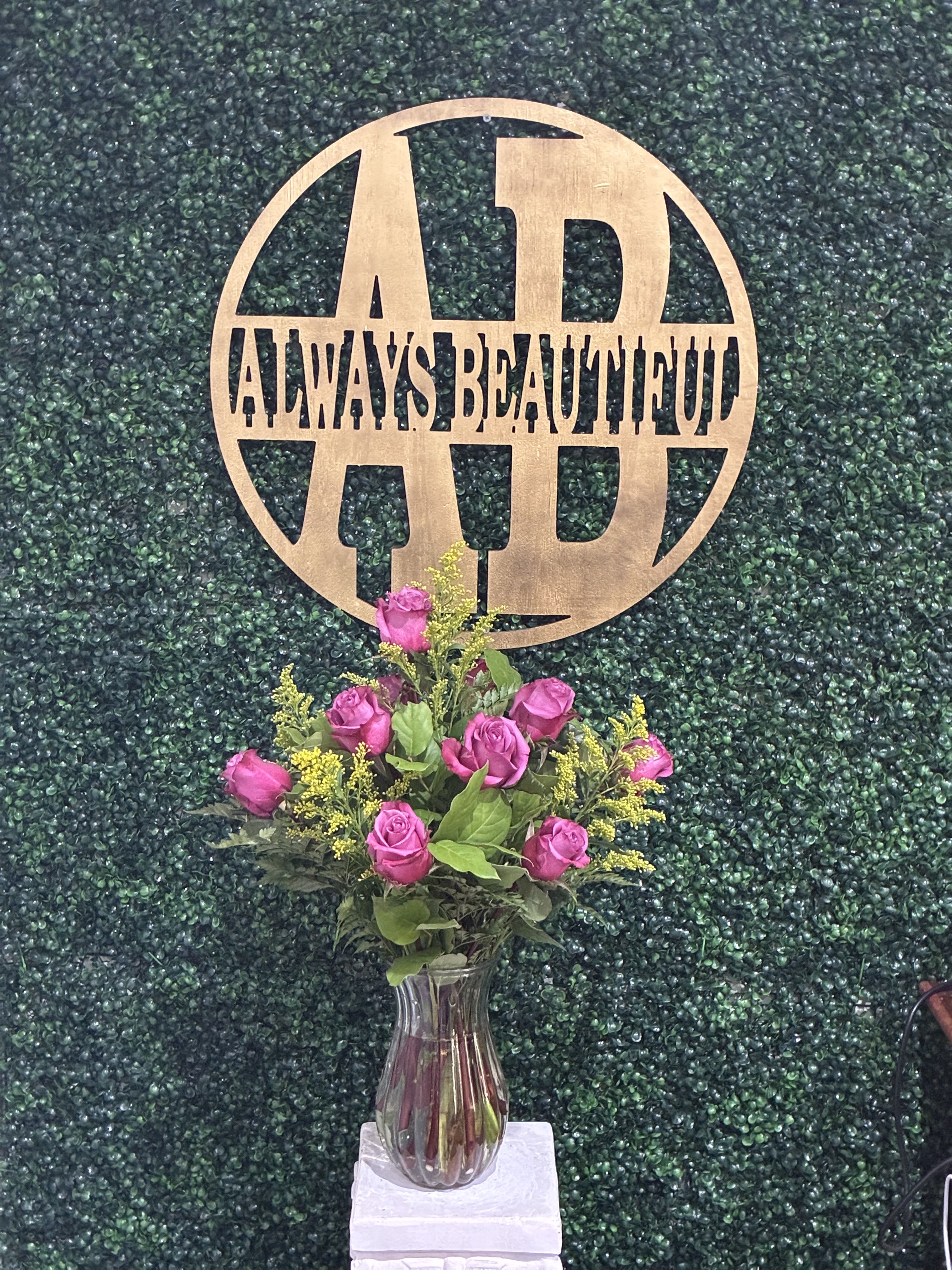 Dozen Long Stemmed Lavender Roses - This arrangement is the perfect "pick me up" to brighten someone's day. Dozen Long Stemmed Lavender Roses is the perfect gift for a birthday, get well, just because, and thank you.    Arrangement Details: 12 Long Stemmed Lavender Roses and Assorted Greenery APPROXIMATE DIMENSIONS: 25" H X 18" W