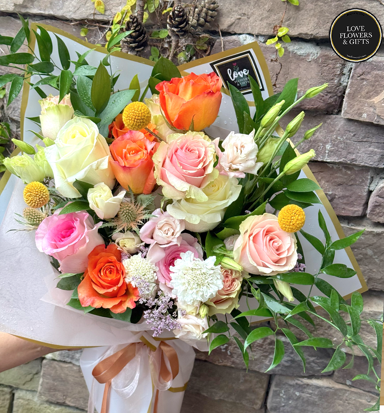 Peach Fuzz (Wrapped Bouquet) - Soft warm colors wrapped in a high quality floral paper with satin ribbon 