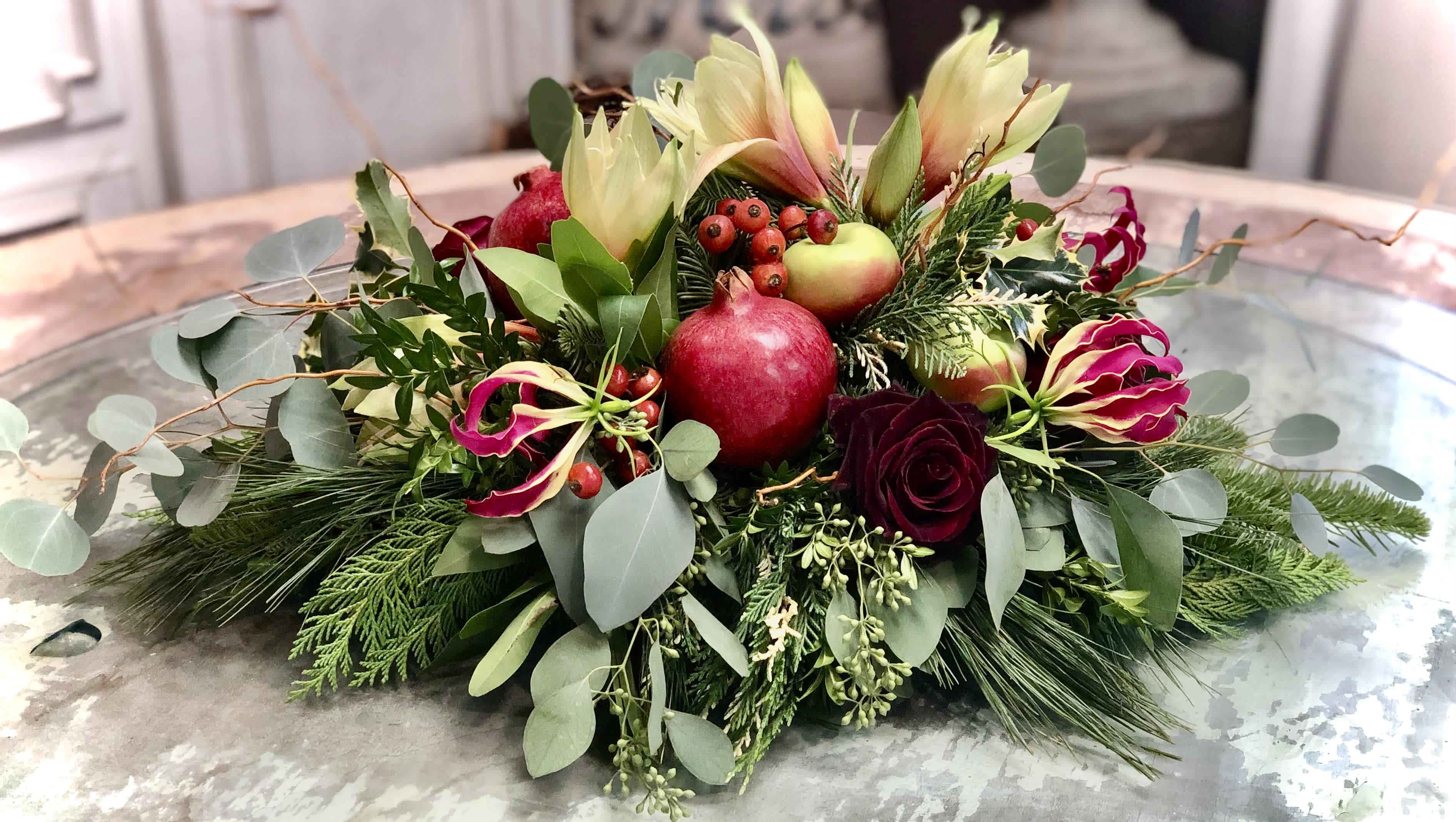 FESTIVE HOLIDAY ARRANGEMENT - This abundant display of fresh, seasonal blooms makes a statement that will be a festive addition to your table. 