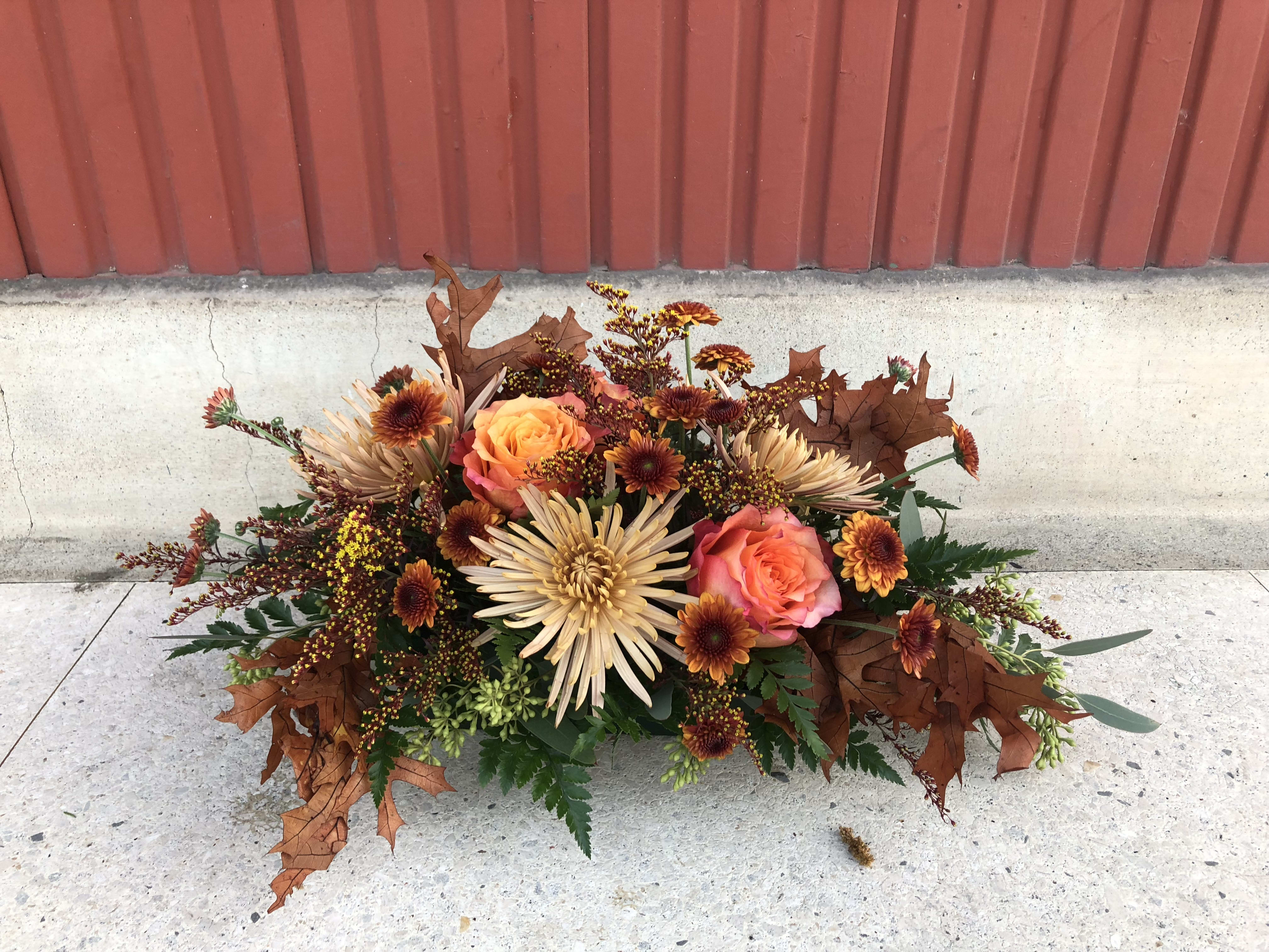Gravy Baby - Gravy Baby is equal parts tradition &amp; beauty.  Perfect for the tables keeping it strong in convention.  A traditional centerpiece, composed in a no show container full of harvest blooms and foliages.   This baby is gravy.  Measures 12in long, 5in wide   