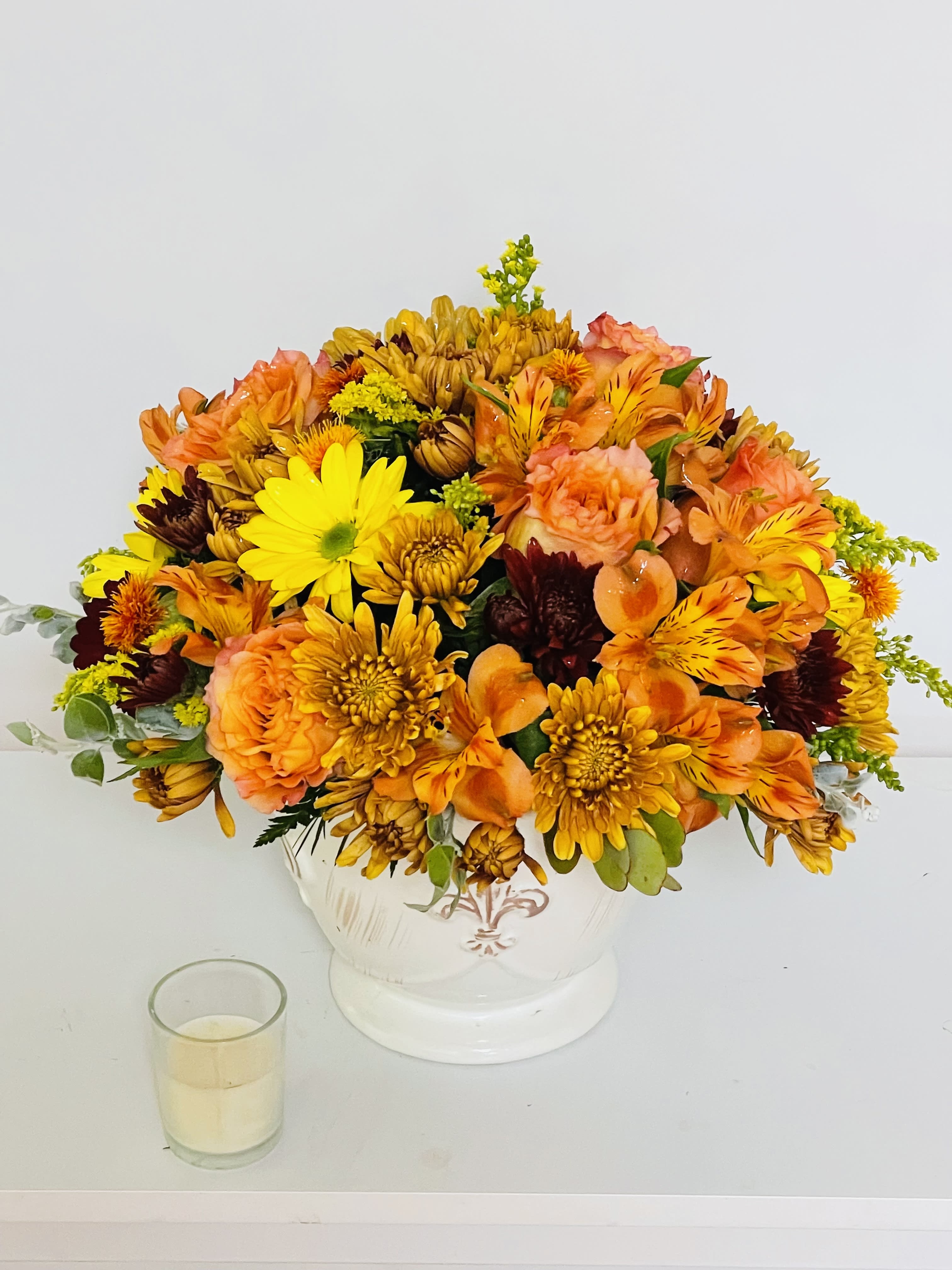 Country Splendor - Lush yellow roses, yellow alstroemeria, bronze button chrysanthemums and gold cushion chrysanthemums are arranged with greens including magnolia leaves, huckleberry, seeded eucalyptus, lemon leaf and natural wheat
