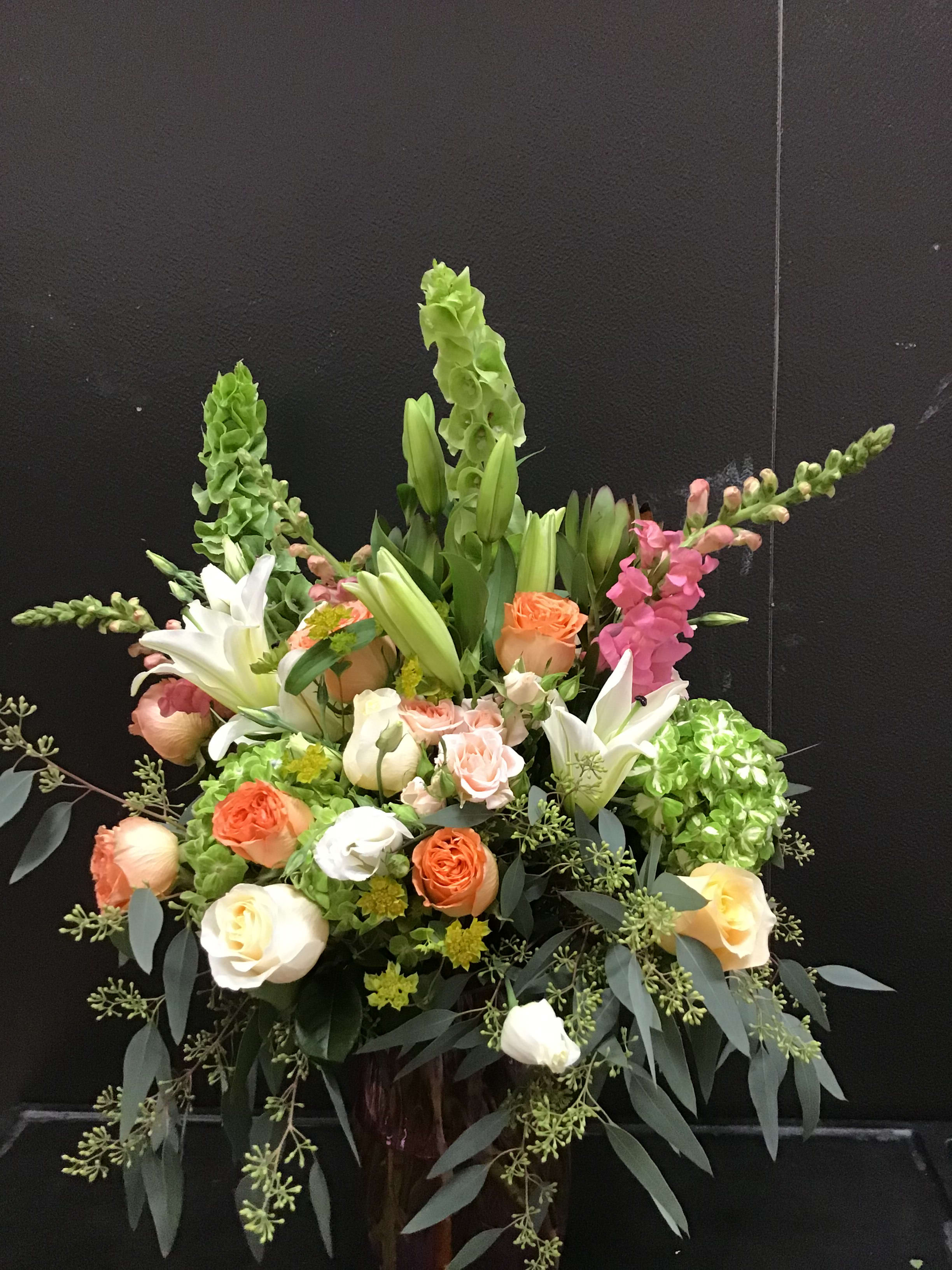 You're Special arrangement  - This beautiful arrangement make with peach and cream color roses, white lily , pink snapdragon , bell of ireland, green hydrangea, and seeded .it is a good idea gift for a special person. 
