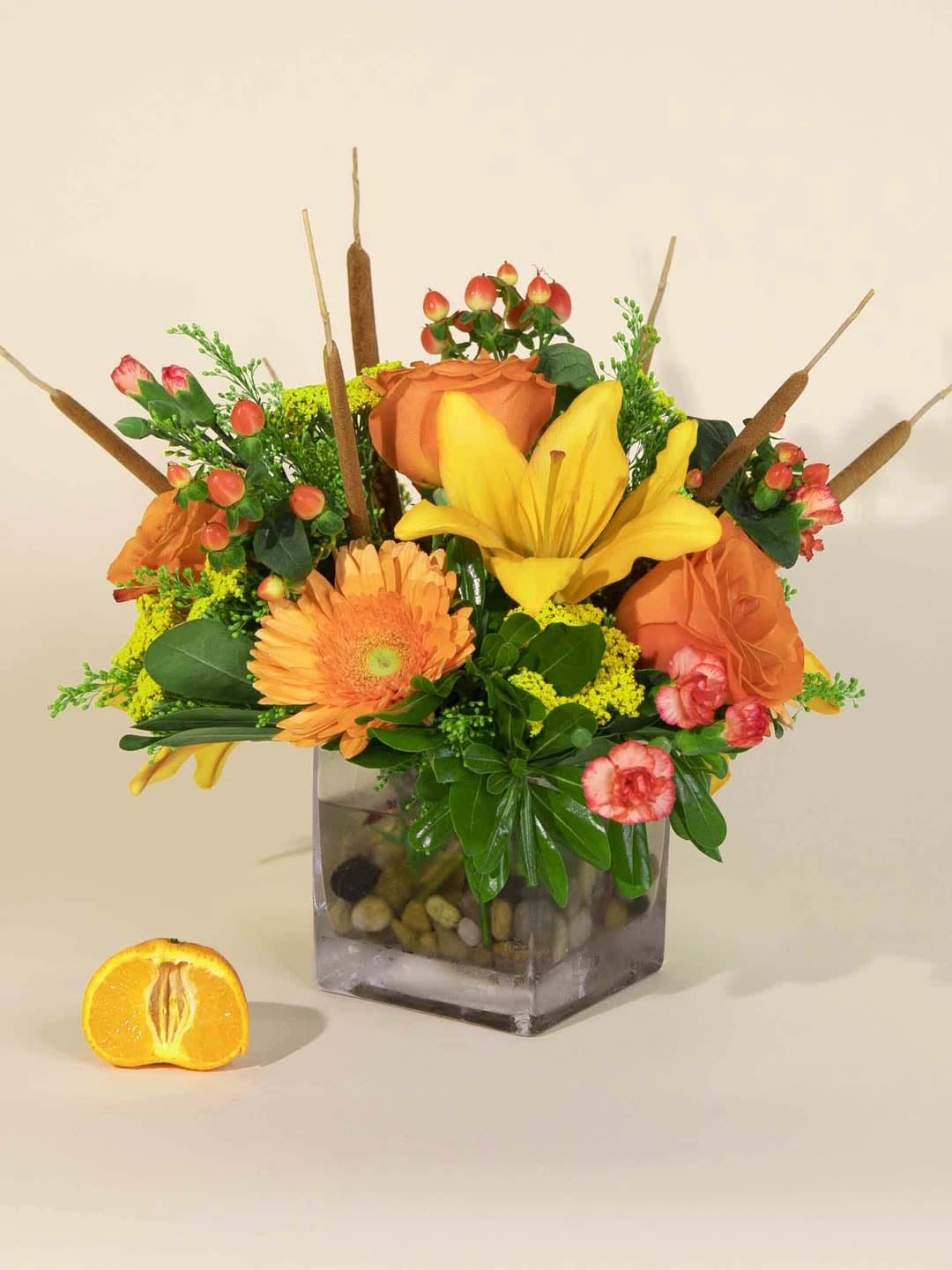 Fall for Me - An exquisite collection of fall colors arranged in a cube. Flowers may include roses, mini carnations, gerbera daisies, alstroemeria lilies, hypericum berries, solidago, lush greens and fall accents.