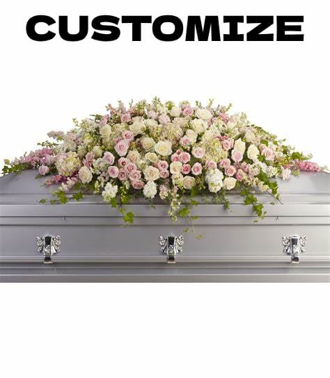 Custom Full-Casket Spray - Honor your loved one with a custom Full-casket spray, thoughtfully designed to reflect their memory with beauty and elegance. This floral arrangement is placed on the casket, offering a heartfelt expression of love and remembrance.  Personalize your tribute by leaving a note at checkout with your preferences—select specific flowers, colors, or a meaningful theme to create a truly unique arrangement. Our skilled florists will carefully craft a stunning display that conveys your deepest sympathies.  Each spray is made with fresh, premium blooms, arranged with care to provide a graceful and comforting presence at the service.  Let us create a meaningful tribute that honors your loved one’s memory. Share your vision, and we will bring it to life with compassion and dedication.