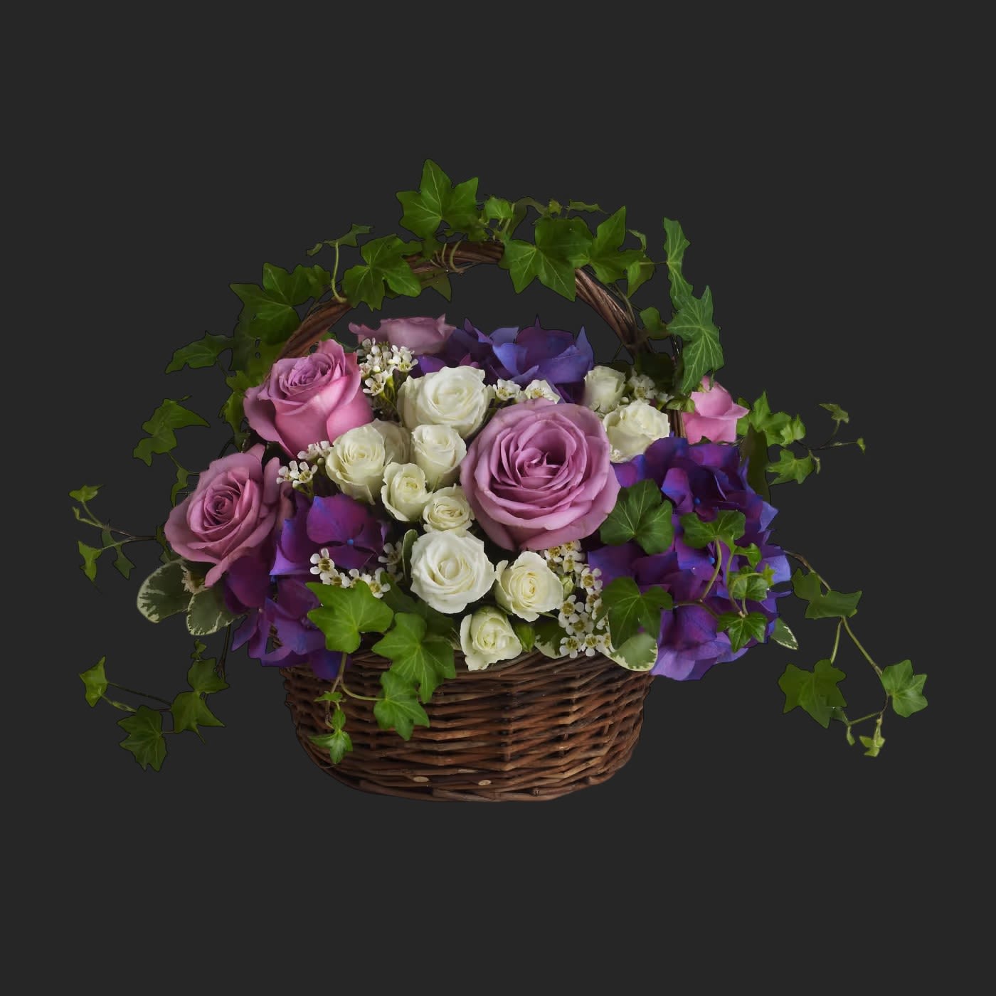 A Full Life by Teleflora - Even in mourning it is important to remember and honor a life well lived. This beautiful basket of purple and white flowers blended with vibrant greenery is a wonderful way to pay tribute to one who has indeed lived a full life.    Brilliant flowers such as purple hydrangea, lavender roses, white spray roses and waxflower are arranged with beautiful ivy and more in a lovely round basket.    Approximately 16 3/4&quot; W x 12 1/2&quot; H    Orientation: All-Around        As Shown : T211-1A      Deluxe : T211-1B      Premium : T211-1C    