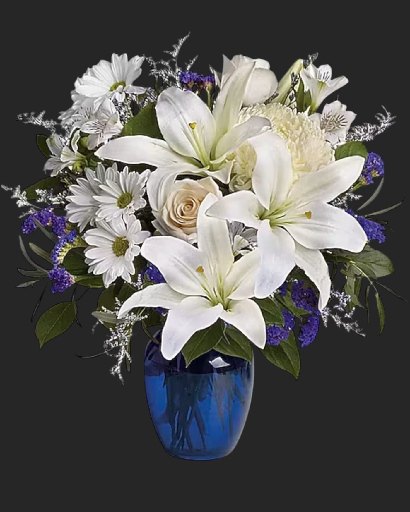 Beautiful in Blue by Teleflora - In this arrangement, the serenity of the color blue along with the purity of intention symbolized by white will let the family know you are sending your calm strength to them during these difficult times.  