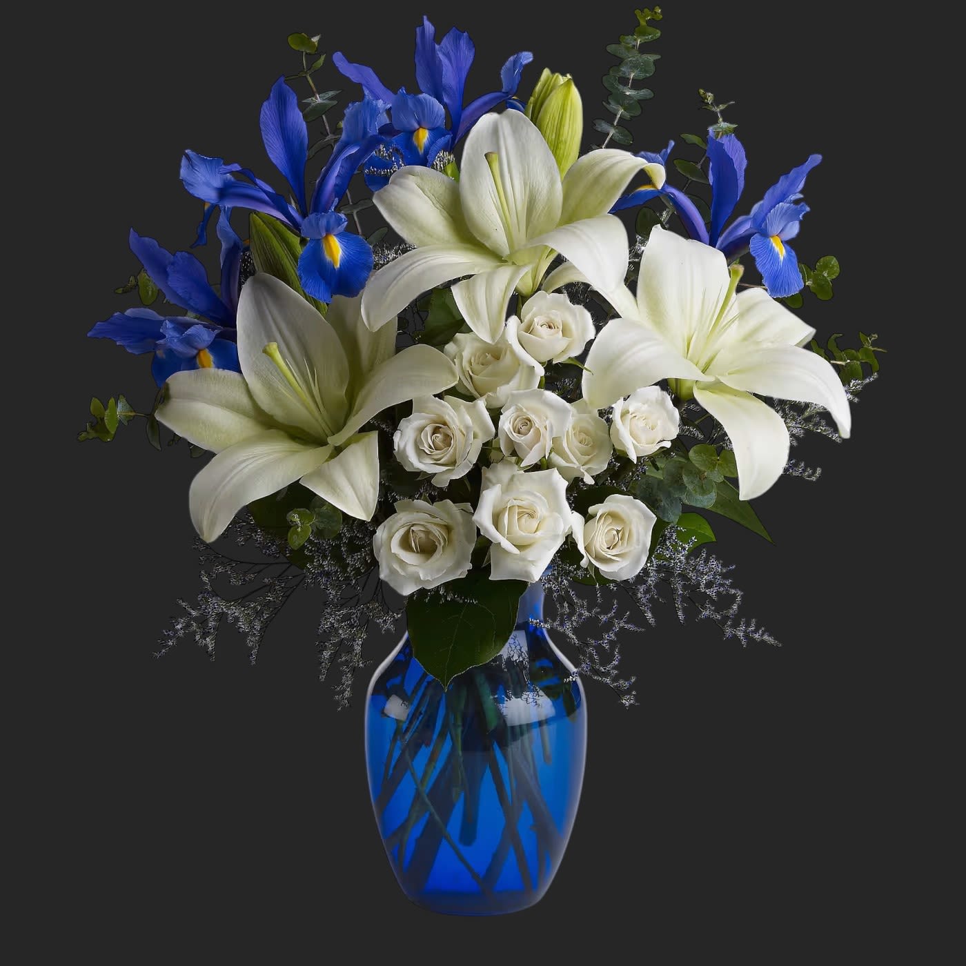 Blue Horizons by Teleflora - As open and bright as a winter's sky, this exquisite mix of white and blue blossoms would make a stunning birthday gift, or a superb Hanukah present for a favorite friend or family member. An eye-catching selection.  