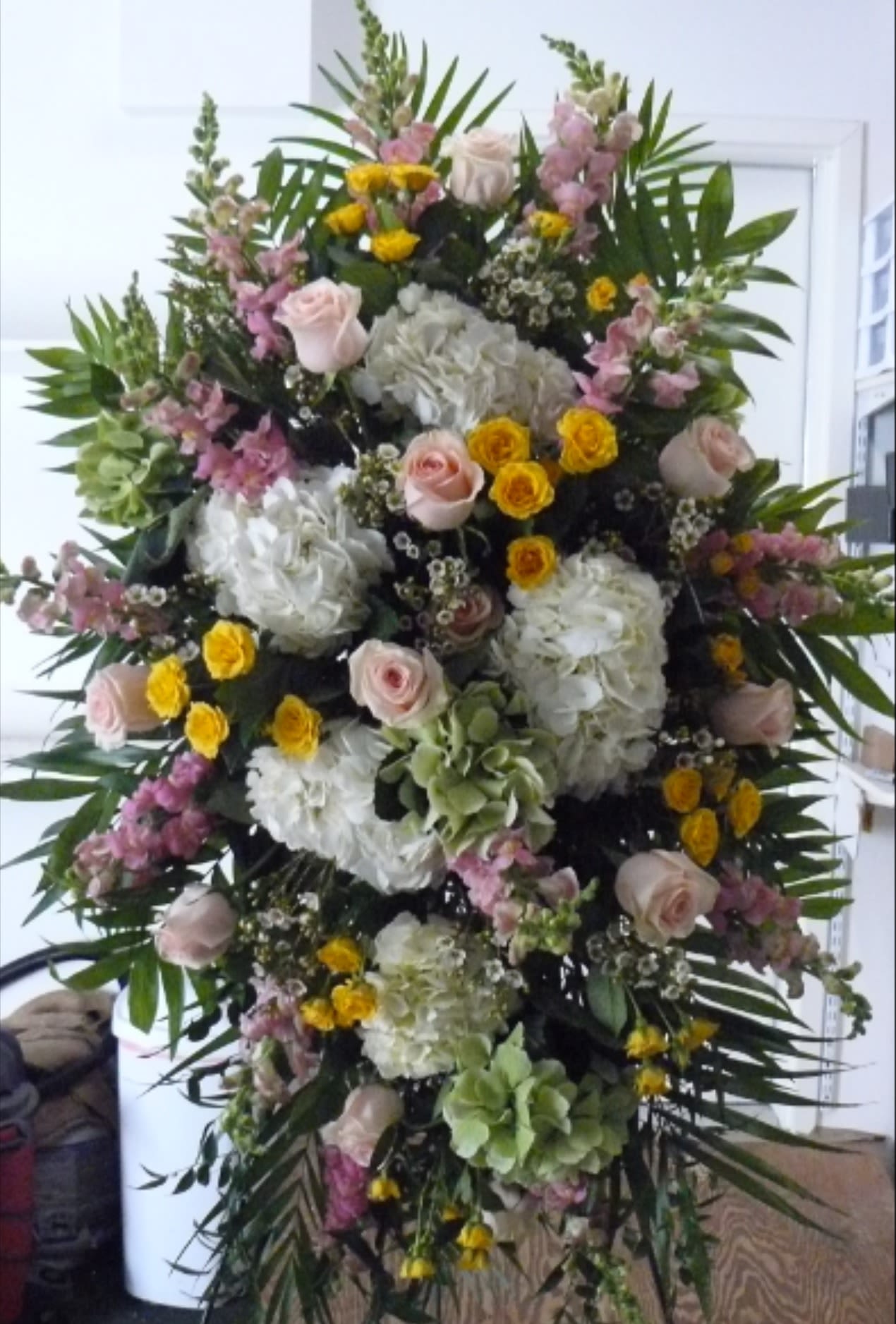 Grande Standing Spray - Multiple Colored Hydrangea, Roses, Spray Roses, Snapdragons, Ruscus, Palms, Fancy Greens