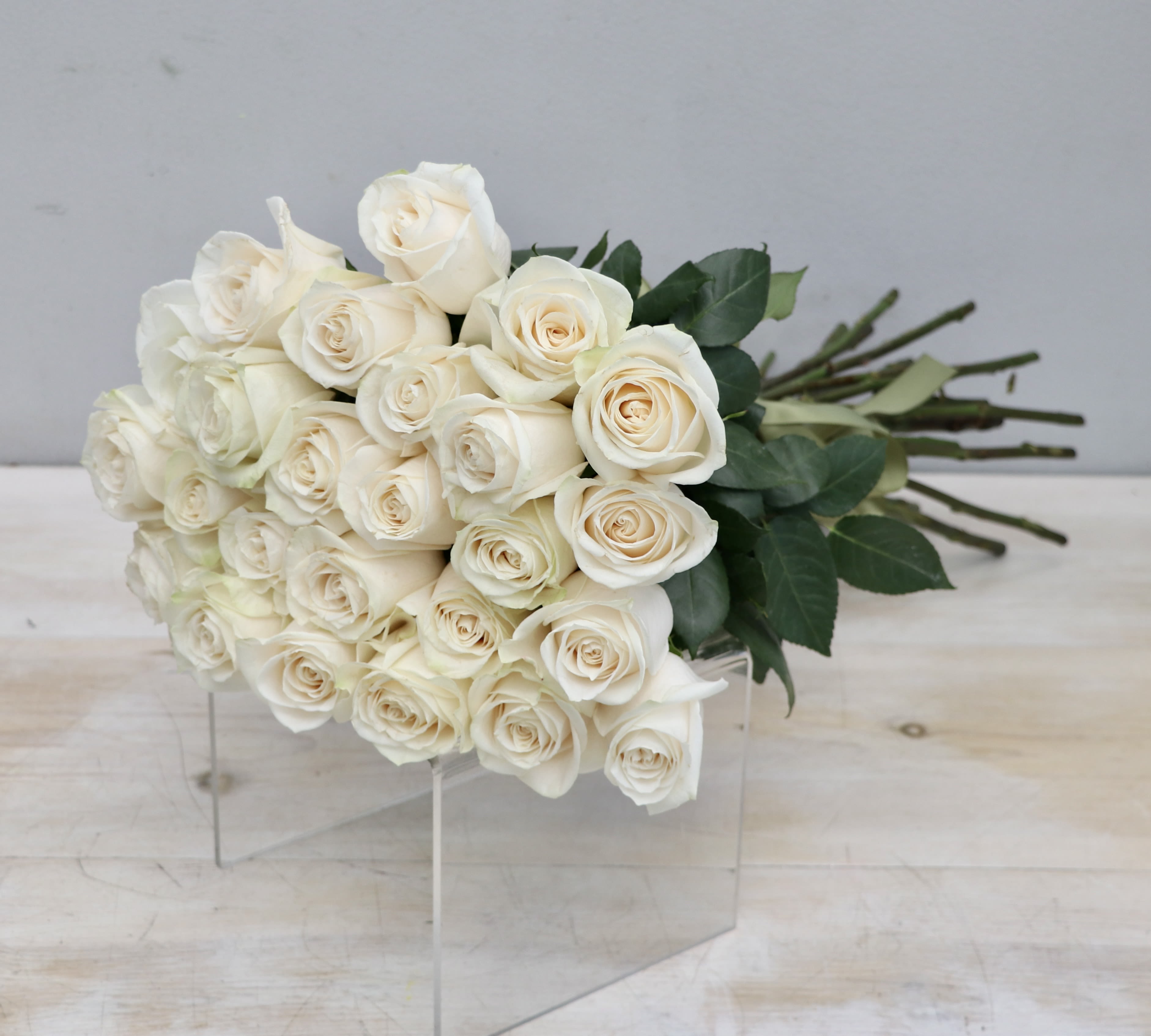 Ivory Rose Special - My Glendale Florist - Roses, roses, roses!!! This bouquet features our tall premium white roses in all their glory.  The standard size has 25 roses, 50 for deluxe, and 75 for premium. This grand bouquet does not come wrapped - please specify if you would like wrapping!