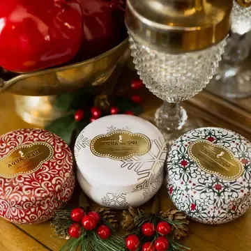 Holiday Trio Set of Three 4oz. Candle Travel Tins - Holiday Travel tin candle trio set of three 4oz tins  Holiday Spice: Nutmeg, cinnamon &amp; vanilla bean  Tis the Season: Peppermint bark and sparkling sugar  Mistletoe &amp; Holly: Fraser fir and juniper berry