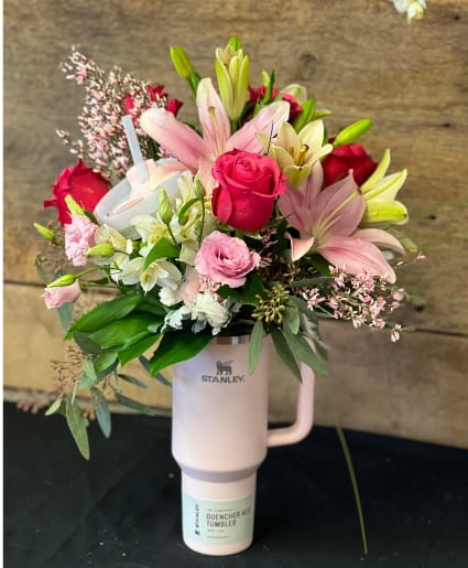 Bloom &amp; Sip Signature - Surprise someone special with our exclusive Bloom &amp; Sip – Stanley Cup Arrangement  Each piece is handcrafted with fresh seasonal blooms and arranged inside an authentic Stanley 40oz tumbler. A truly unique gift that blends beauty and function — once the flowers have faded, the cup can be reused for years to come.