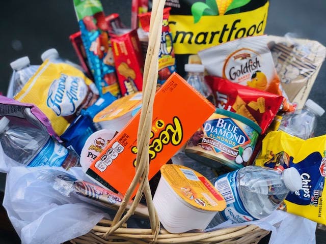 Thinking of you and the family - Snack time Favorites Gift Basket. Guaranteed to satisfy the snack cravings, with popcorn  licorice, Famous Amos chocolate chip cookies, fruit candies, chocolates ,nuts, crackers, bottled waters and more. Send one across the miles today for any occasion or no occasion at all.