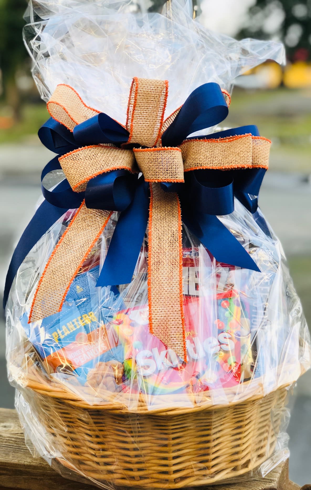 THE MANS GOODIE BASKET  - Send this caring expression of some of his all time favorites!  Assorted snacks, nuts, chocolate and other candies. Your thoughtfulness will be remembered