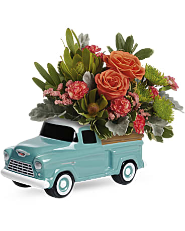 Teleflora's Keep Trucking Chevy Bouquet - Bursting with bright orange blooms, this hand-glazed ceramic Chevy is a perfect &quot;pickup&quot; for any occasion! Orange roses, miniature orange carnations, green cushion spray chrysanthemums, orange sinuata statice and green leucadendron are arranged with dusty miller and variegated pittosporum. Delivered in a Chevy Pickup Keepsake.
