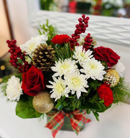 Christmas Cheer - Gorgrous red and white blooms arranged into a glass vase.with fragrant holiday greenery, berries, cones and gold accents.