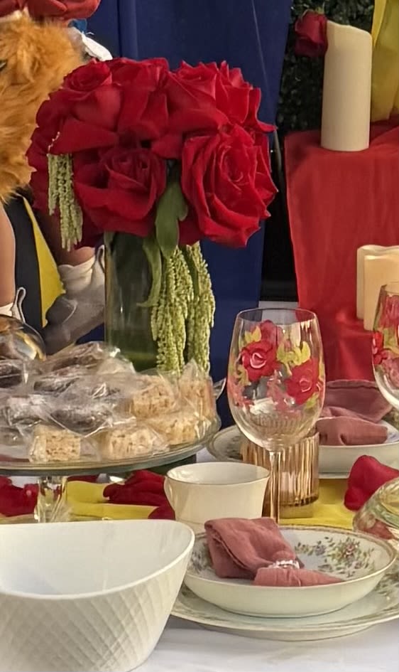 CANDELABRA ROSE CENTERPIECE - Beautiful centerpiece- This arrangement shows off beautiful red butterfly red roses. Great table piece for any celebration.   
