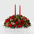 Classic Holiday - Share the joy of the season with a centerpiece full of festive blooms and gorgeous season's greetings. A collection of bright red roses, carnations and mini carnations are elegantly put together among assorted holiday greens and fresh, natural pinecones