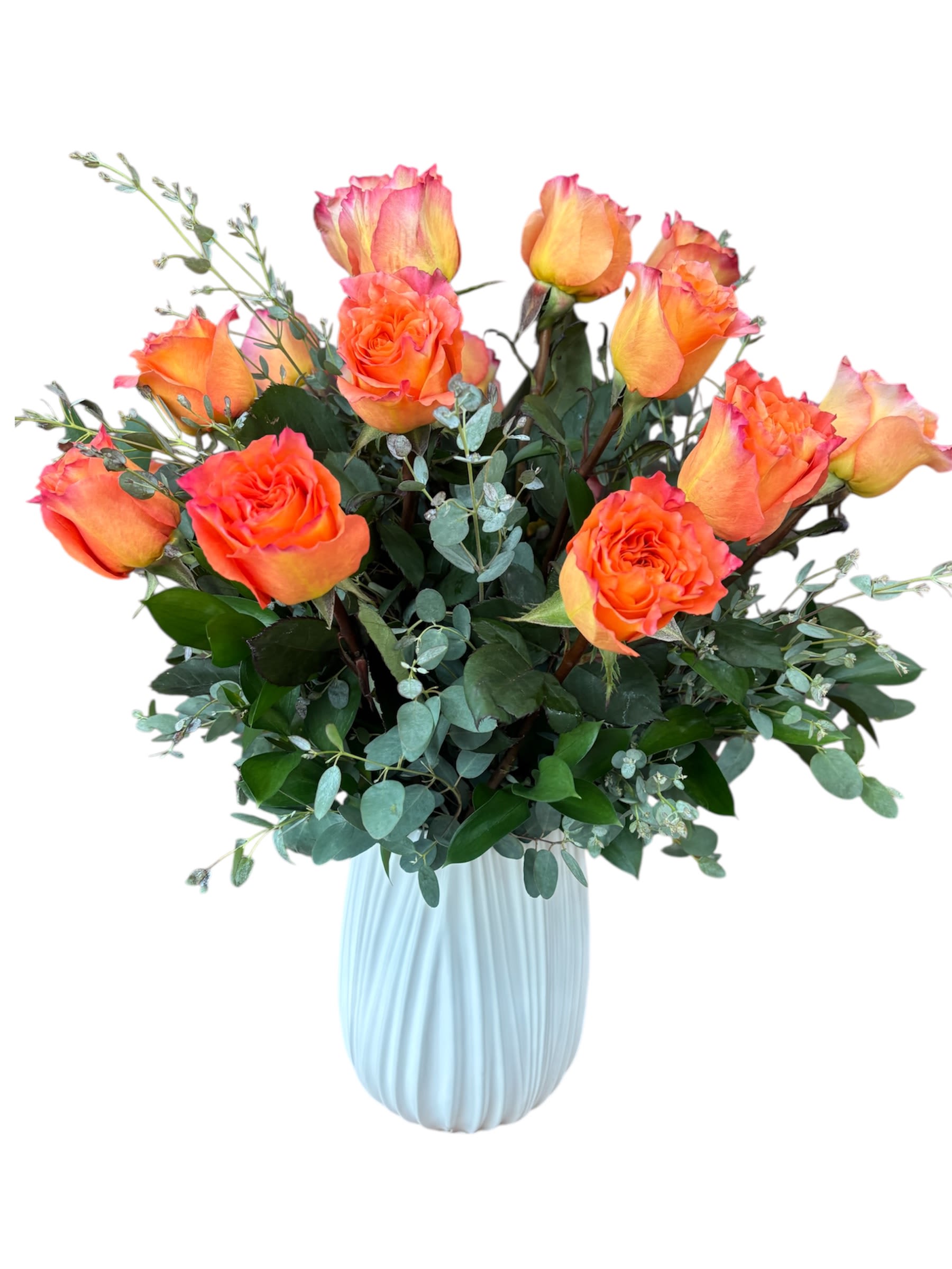 18 Free Spirit roses - Bright and uplifting, 18 Free Spirit roses in a white tulip vase bring a burst of happiness to any space. Their playful colors and elegant presentation make them perfect for celebrations or everyday delight.