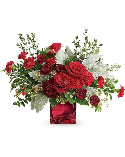 Rich In Love Bouquet by Teleflora - Unforgettable in every sense of the word! Make a dramatic impression with this ultrachic arrangement, featuring a modern organic shape, luxurious blooms, and a shimmering keepsake cube vase. This dramatic bouquet features red roses, dark red spray roses, maroon carnations, red miniature carnations, dusty miller, leatherleaf fern, huckleberry, seeded eucalyptus, lemon leaf, and parvifolia eucalyptus. Delivered in a Red Mirrored Cube.