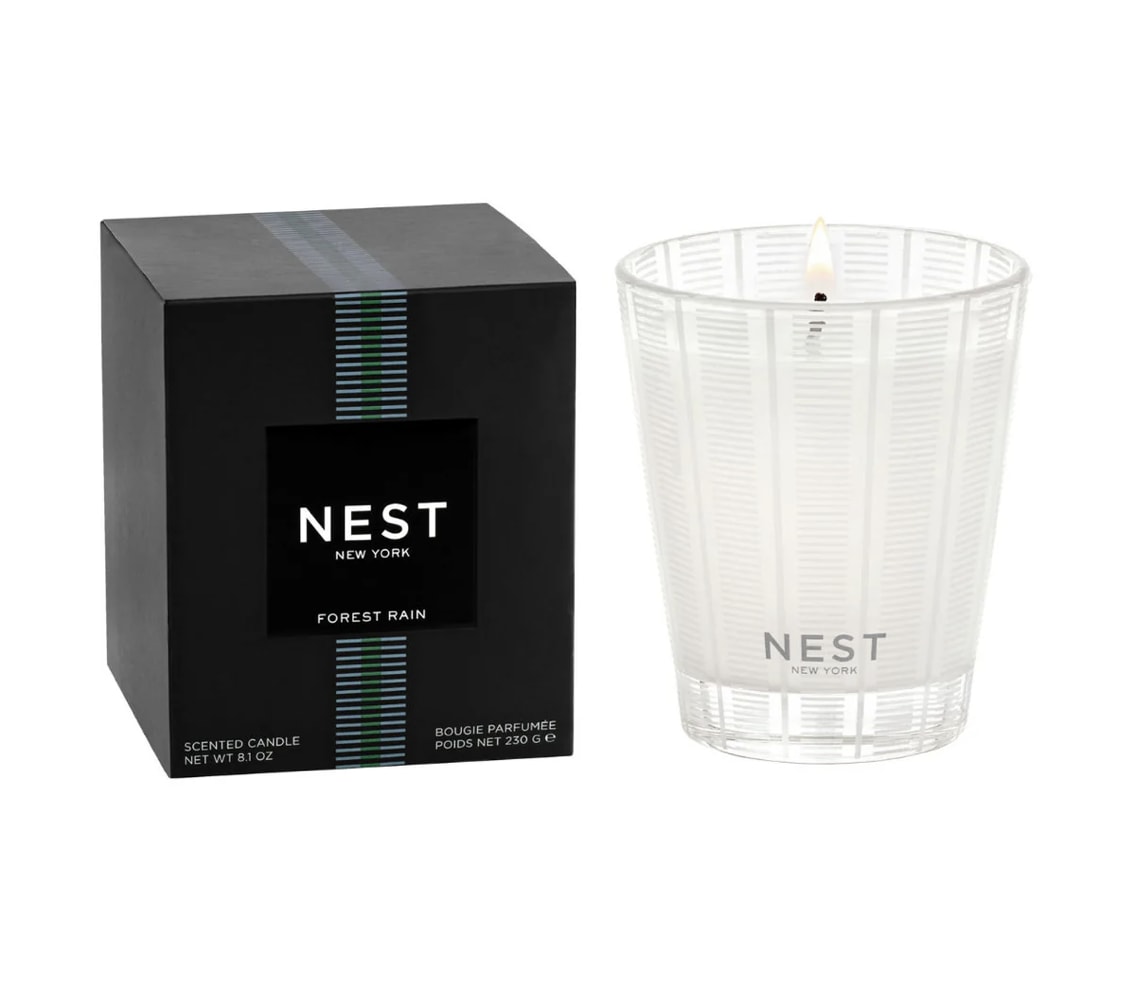 Nest Classic Candle - Forest Rain - This 8.1oz Nest Classic Candle is cruelty free &amp; vegan, has a 60 hour burn time, is housed in a reusable glass holder, and is formulated so the candle burns cleanly and evenly. Tax free. Same-day hand delivery.  Discover the art of giving at Petals, Wilmington, Delaware’s destination for luxury gifts and home décor. Our curated collection features beautifully crafted items for every occasion — birthdays, weddings, anniversaries, holidays, and life’s special celebrations. At Petals, we believe every gift should tell a story. From hand-poured candles and elegant keepsakes to stylish home accents, gourmet treats, and floral-inspired décor, our selection combines timeless charm with modern sophistication. Each piece is chosen with care to reflect the quality, creativity, and personal touch our Wilmington customers love.  Same-day delivery available throughout Wilmington and nearby areas including Greenville, Hockessin, Newark, and the Brandywine Valley Whether you’re looking for a thoughtful hostess gift, a luxury home accent, or something simply beautiful to brighten someone’s day, Petals offers fine gifts and personalized service that make every occasion memorable.  Visit our Wilmington boutique or shop online today — and see why Petals is Delaware’s trusted name for fine gifts and inspired giving.