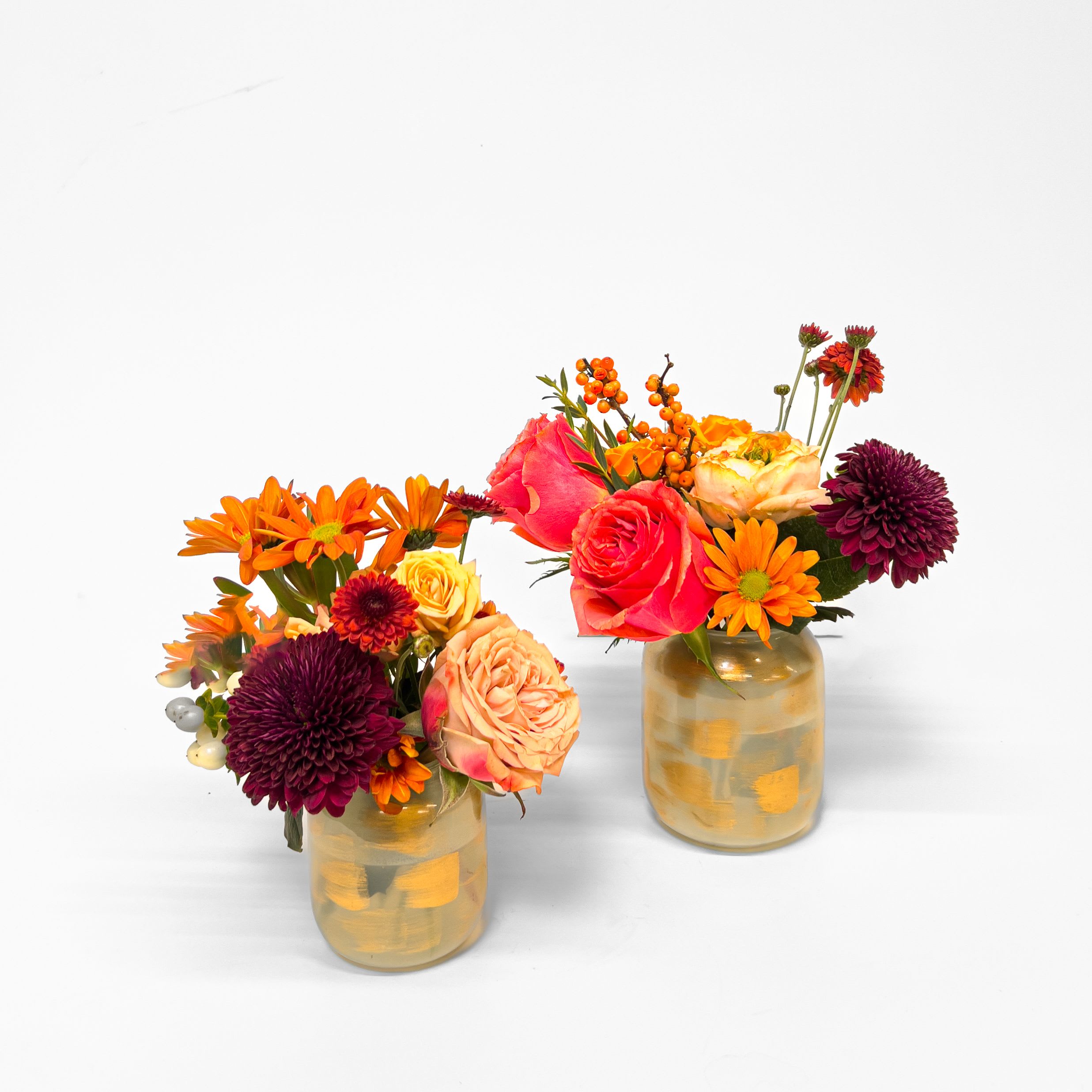 Giving Thanks - A pair of gold-accented budvases featuring mixed autumn blooms. Perfectly petite for crowded Thanksgiving tables, these elegant vases add a touch of seasonal warmth and make a thoughtful hostess gift.