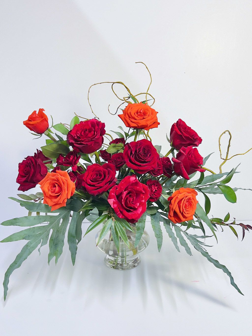 Amour - Amour redefines the classic dozen red roses with a modern twist. This elegant arrangement takes the timeless symbol of love and elevates it with a truly romantic, refined, and sophisticated design.