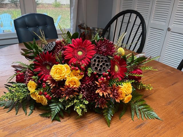 Family Gathering Centerpiece - Long and low centerpiece designed in a low dish with beautiful seasonal flowers and greens. Perfect for a long rectangular or oval table, an elevated backdrop for your buffet table or a welcome centerpiece for your foyer area. Measurements approximately: 28&quot;L x 19&quot;W x 9&quot;H