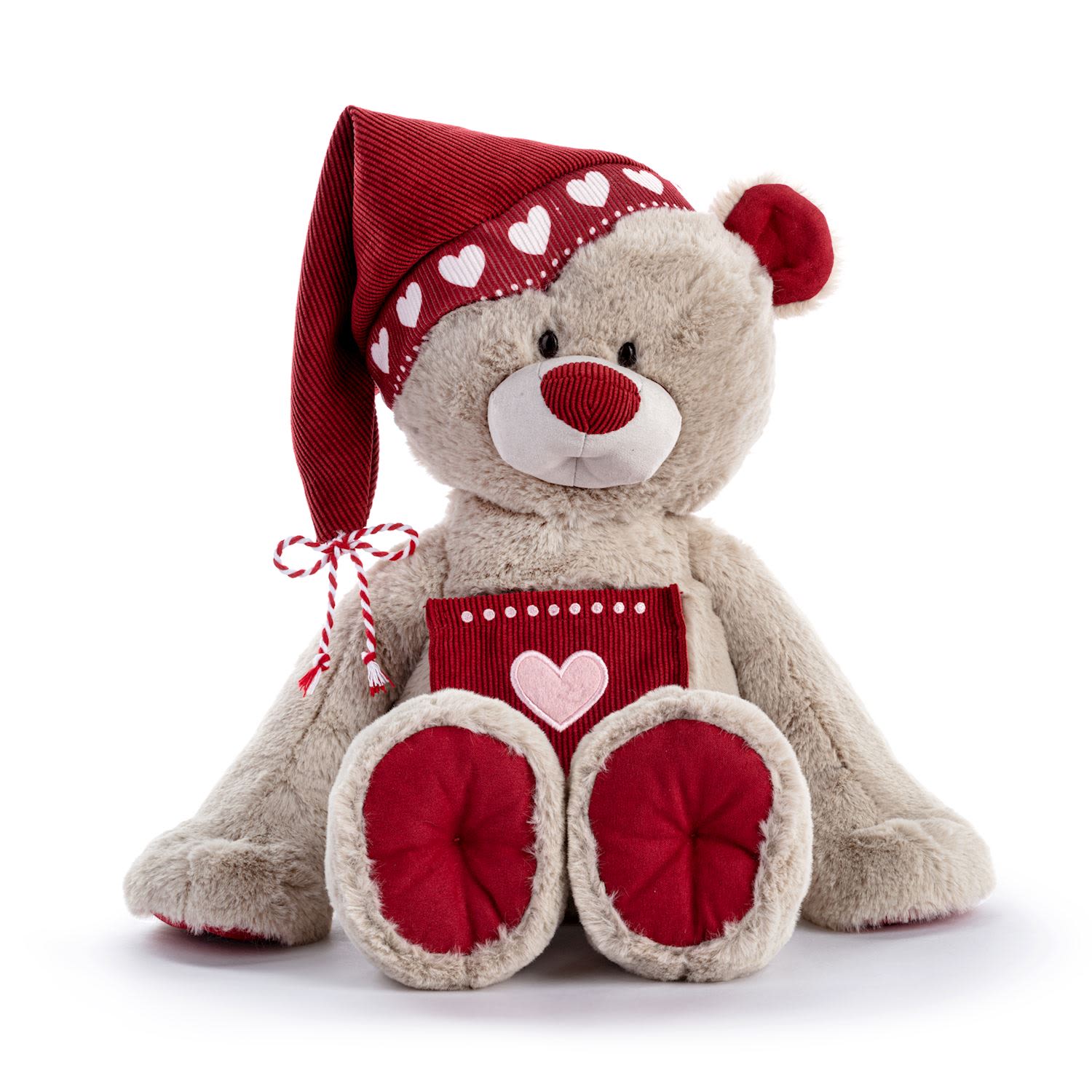 Holiday Kindness Bear - Share the warmth of the season with our Holiday Kindness Bear — a cuddly reminder that love and kindness are the best gifts of all.  Dressed in a festive red hat sprinkled with hearts and finished with a sweet bow, this soft beige bear is made for snuggles and smiles. Its adorable heart patch and cozy holiday colors make it the perfect companion for spreading cheer — whether under the tree, on a mantel, or in the arms of someone special.