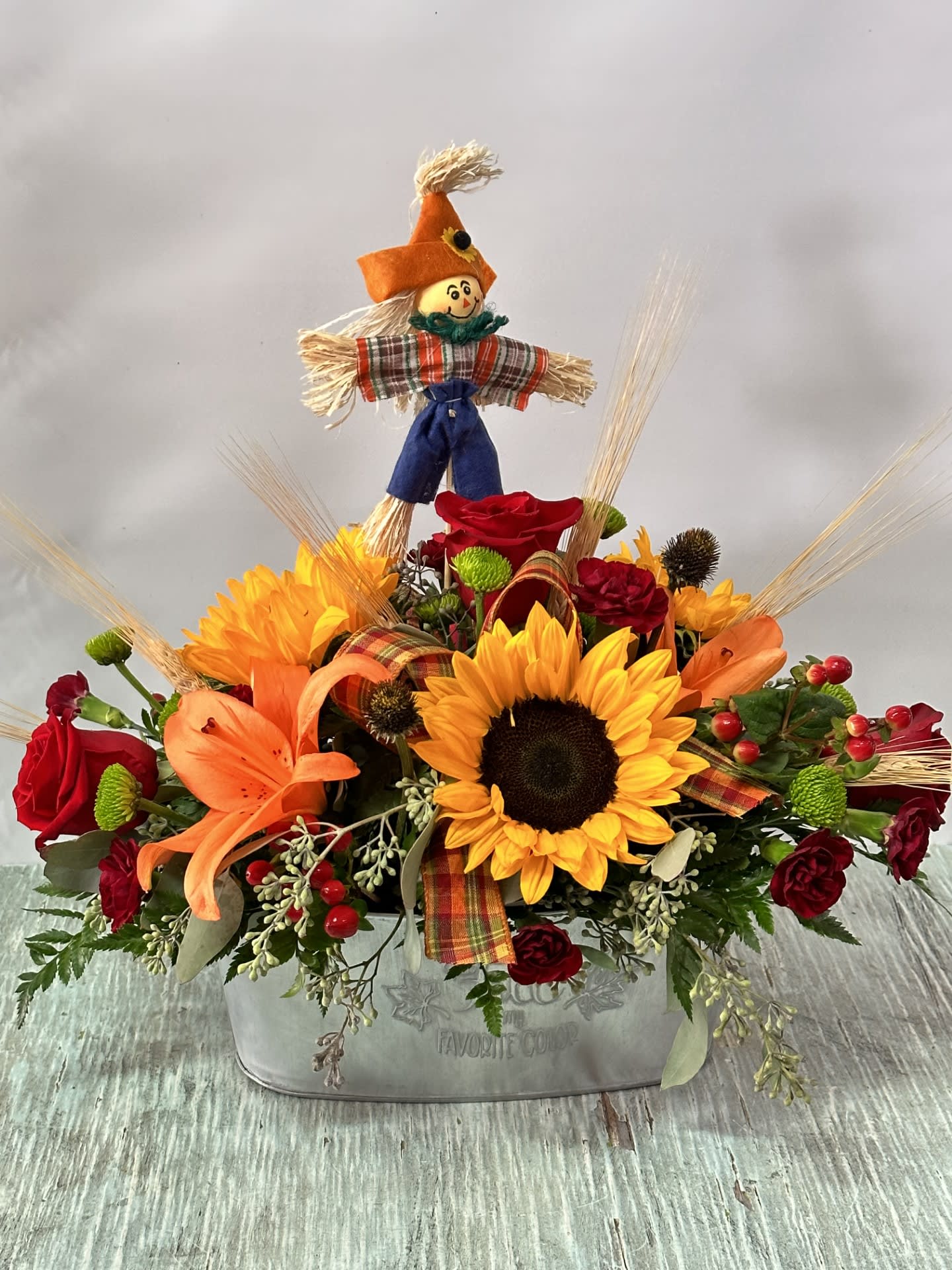 Autumn #3 - Arrangement in a metal container. Container design varies on availability. 2 designs available. See example images for design availability.