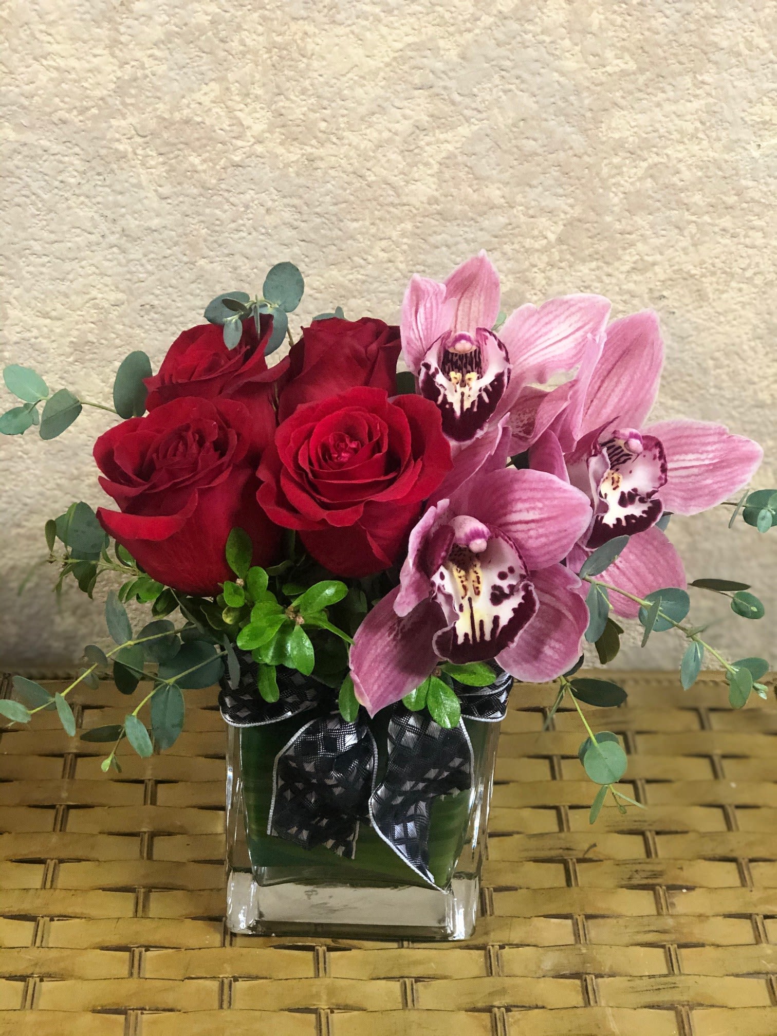 I Treasure You - Type of Flowers: Cymbidium Orchid and Red Roses in a short vase. Availability: All year round Substitute Available: Yes Design View: All Facing View Photo shown: Regular