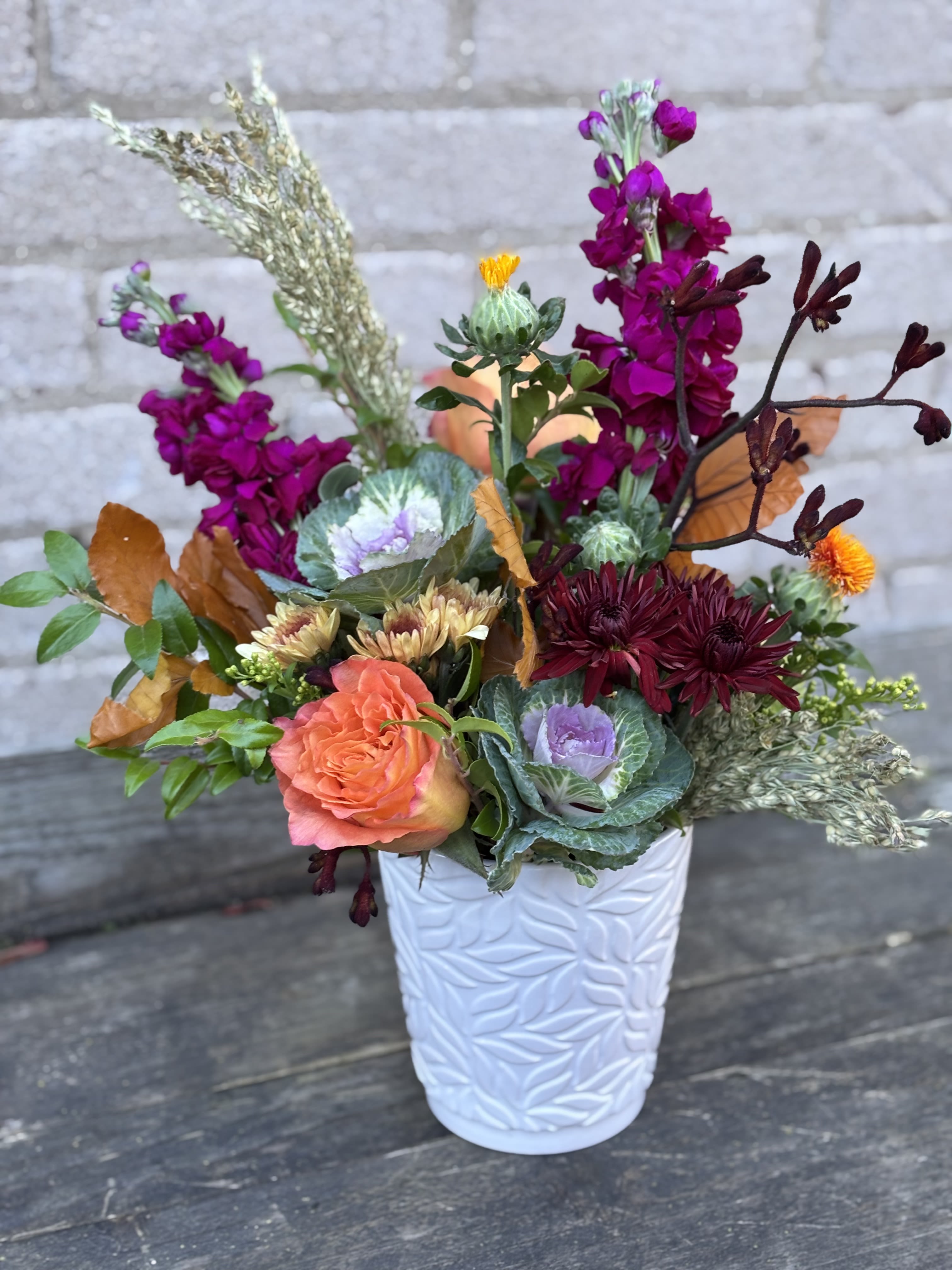 Whimsical Fall - A custom designed Fall arrangement with seasonal blooms and textured greens and fall elements, we will design as close to the picture as possible but blooms do change with the seasons.