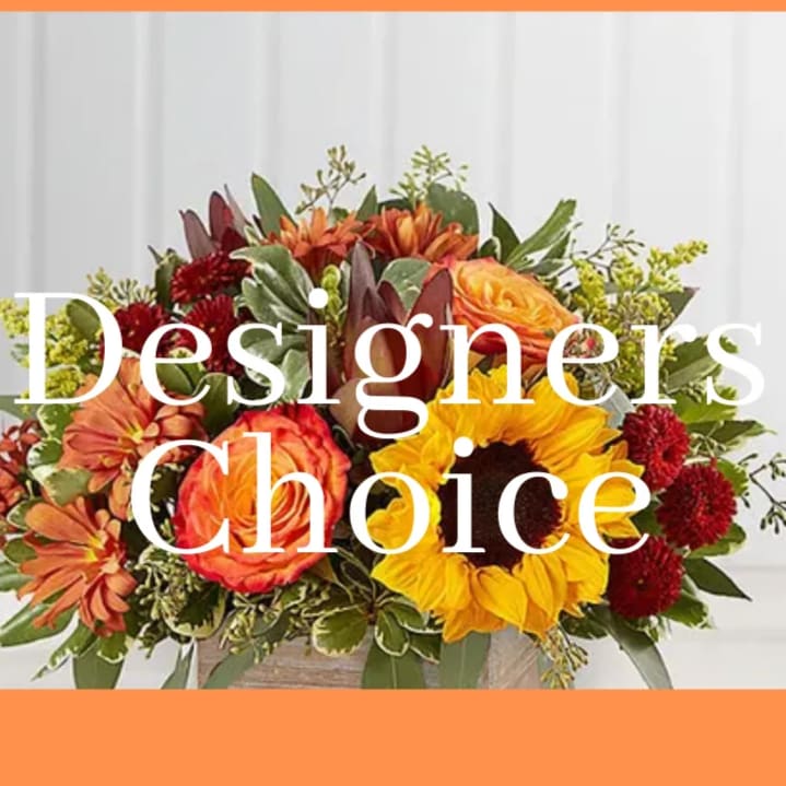 Designers Choice centerpiece - Let our designer's create a beautiful centerpiece for your holiday table. Our expert designers handpick from the day's market to create a one-of-a-kind centerpiece with the seasons best available blooms. * flowers and container will be based on what is available that day. *