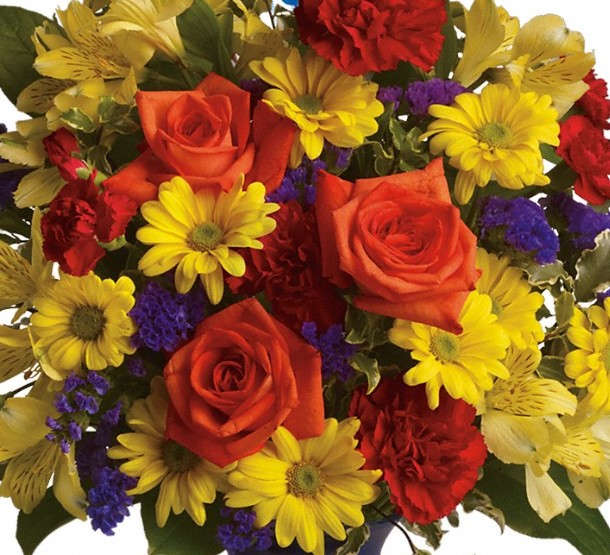 Designers Choice Bright Bouquet - A beautiful bright and bold mix of flowers arranged in a glass vase appropriate for a birthday or get well wishes!
